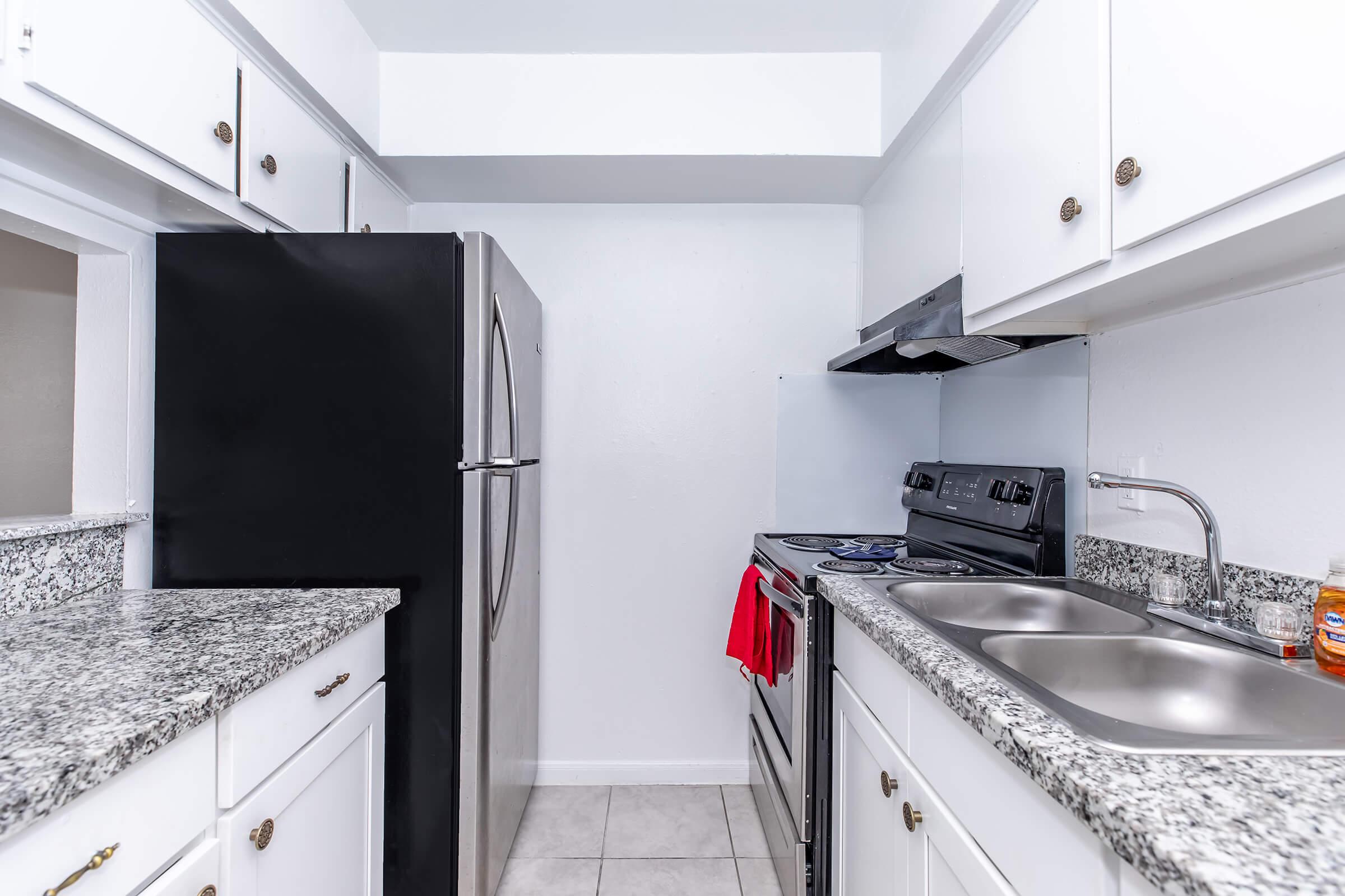 a stainless steel refrigerator in a kitchen