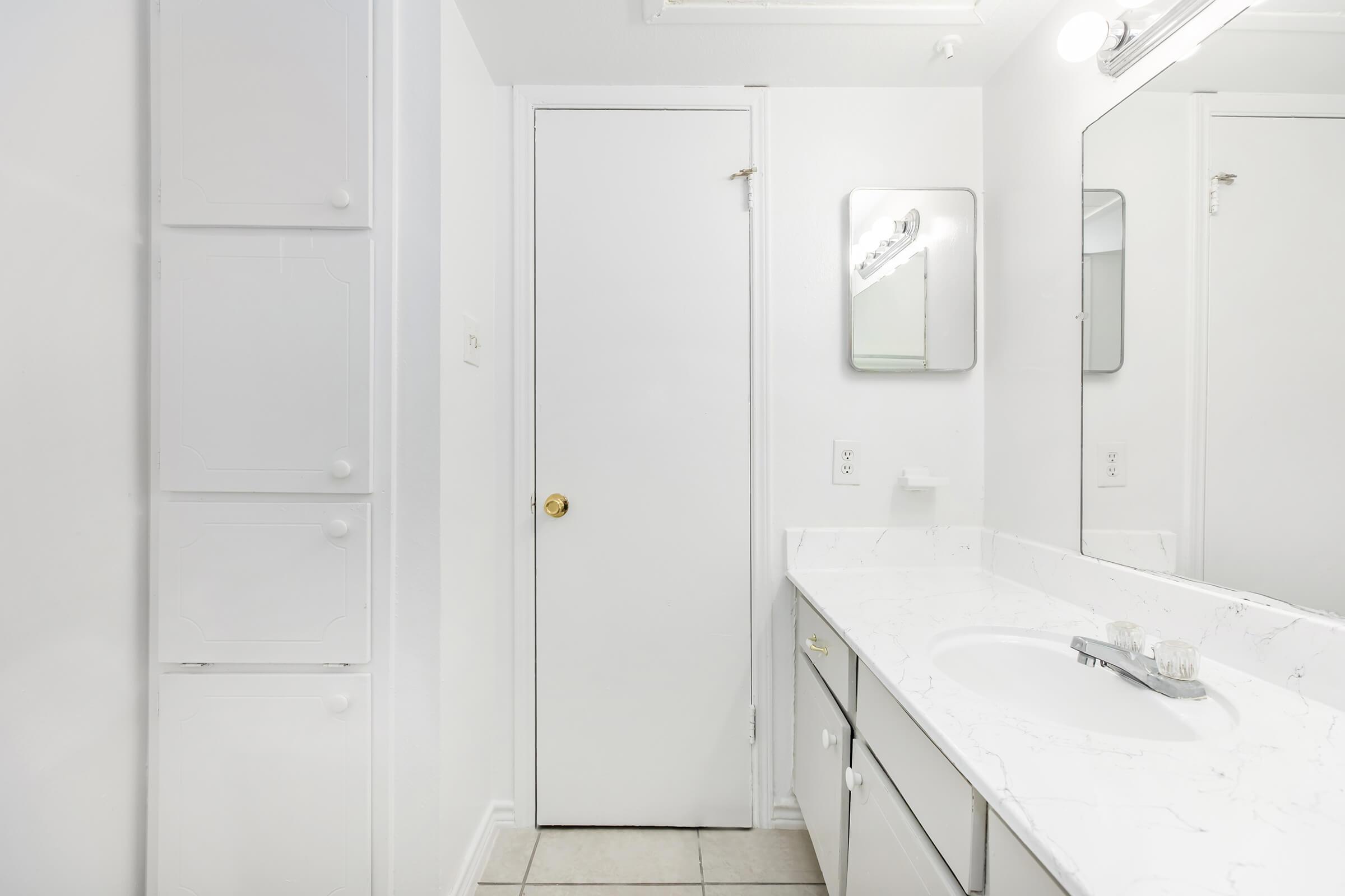 a kitchen with a sink and a refrigerator