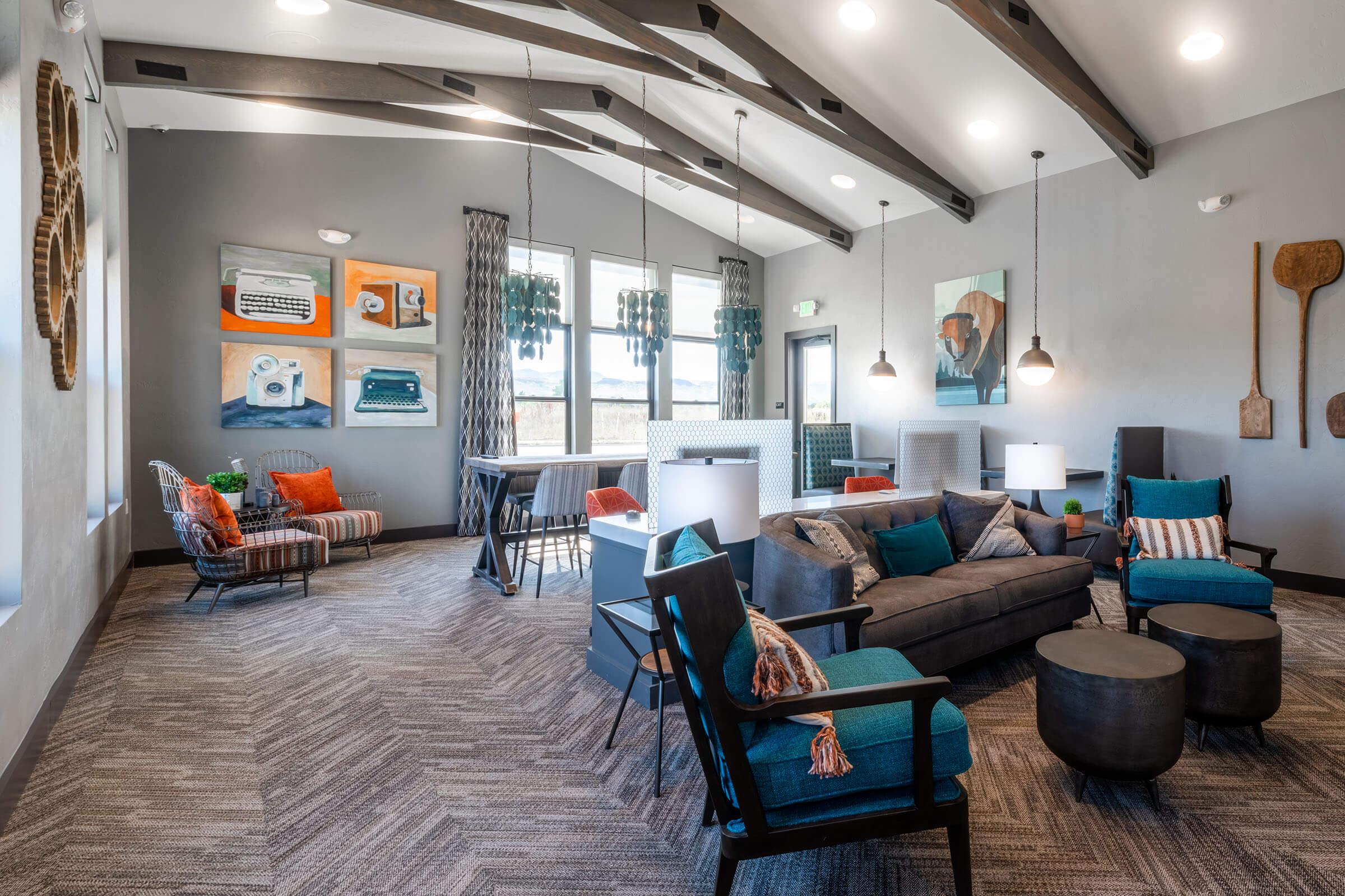 a living room filled with furniture and a large window