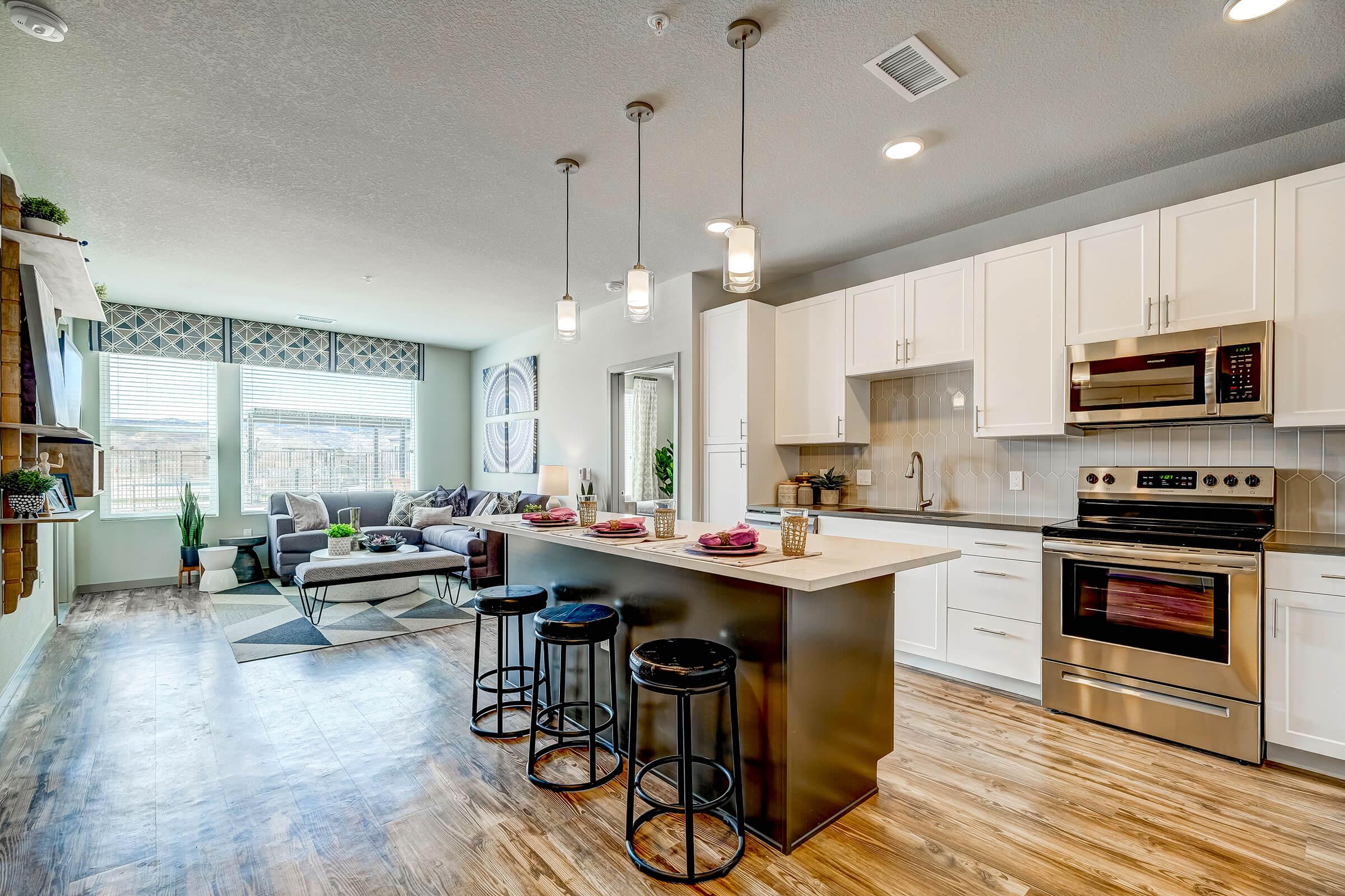 a kitchen filled with lots of furniture