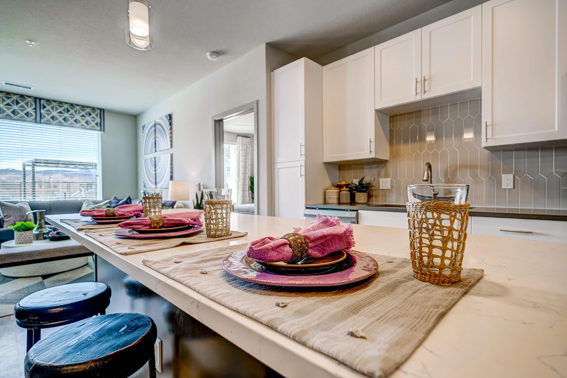 a kitchen with a lot of food on a table