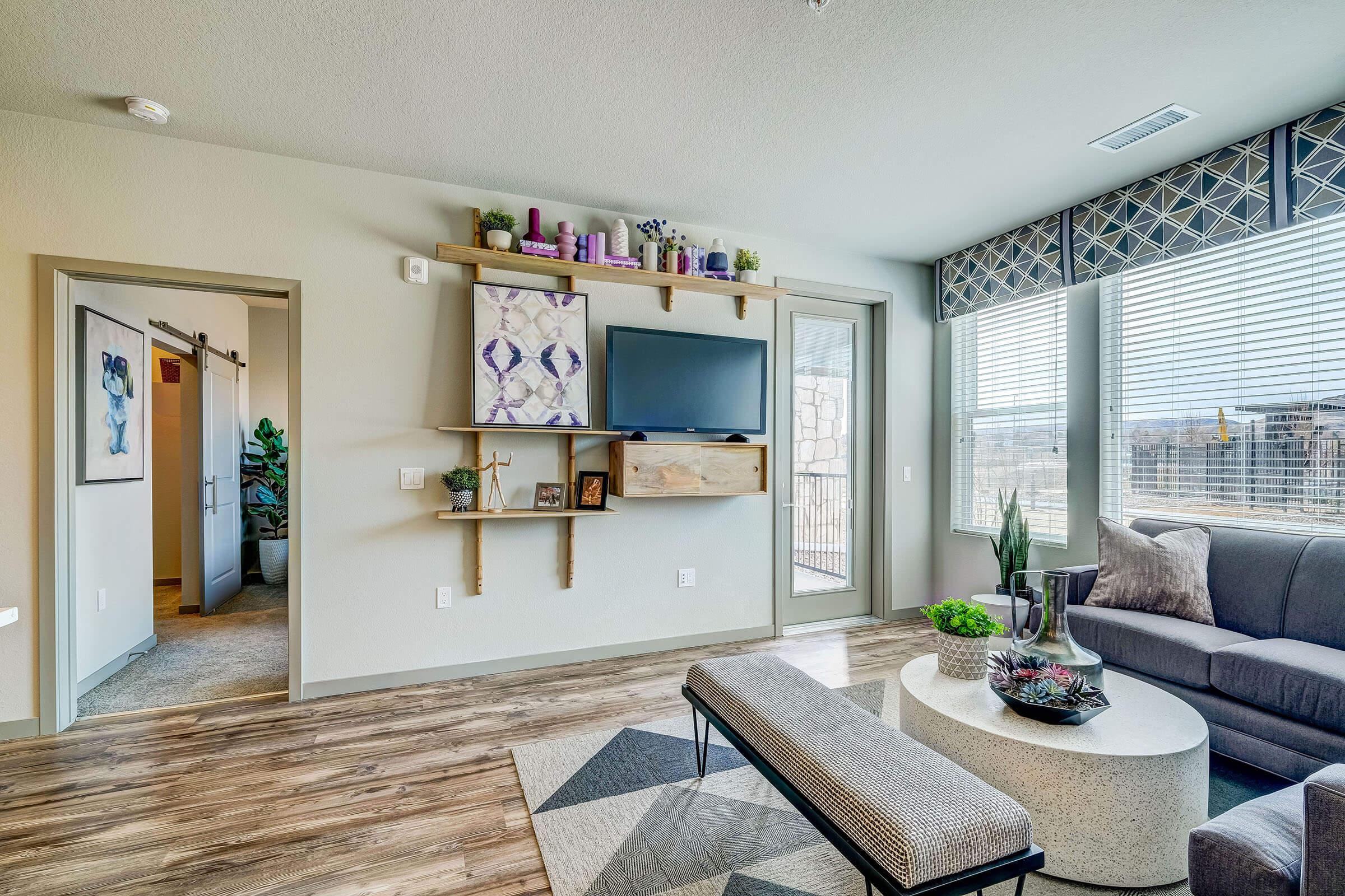 a living room filled with furniture and vase