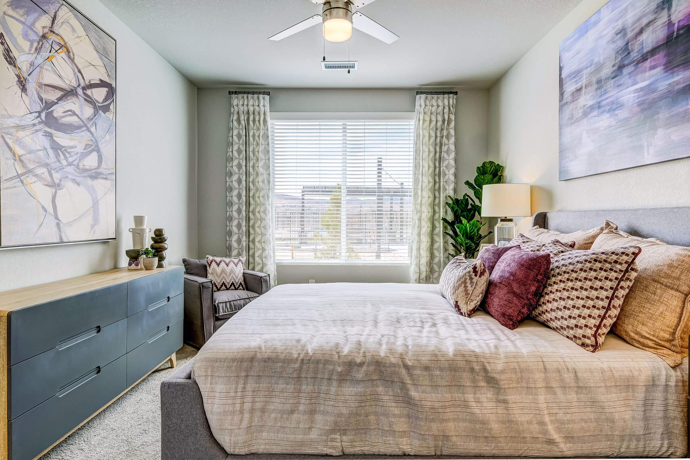 a bedroom with a large bed sitting in a room