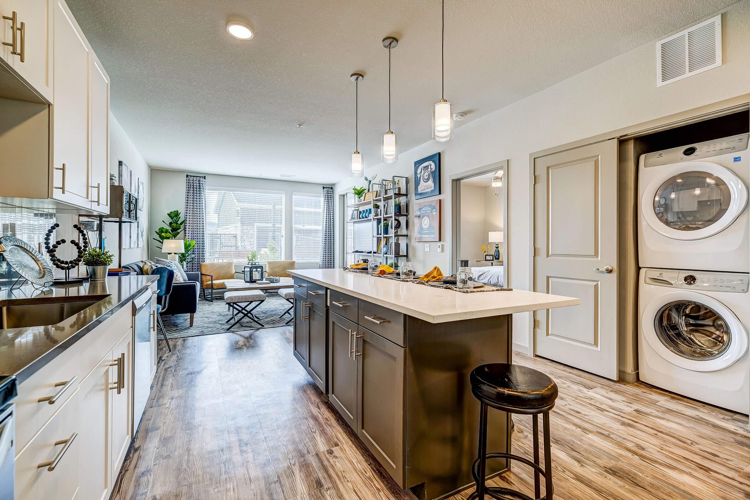 a kitchen filled with lots of furniture