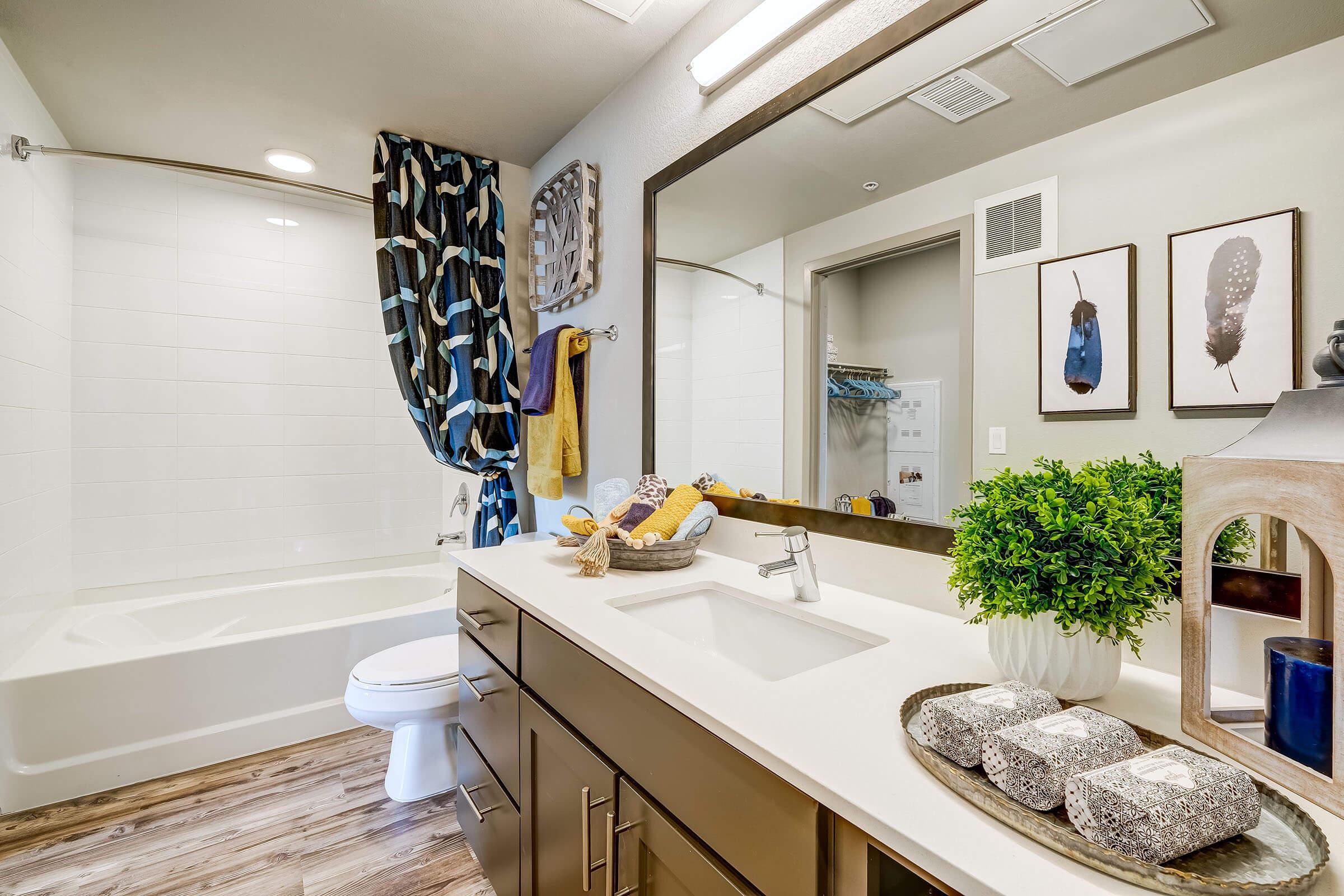 a kitchen with a sink and a mirror