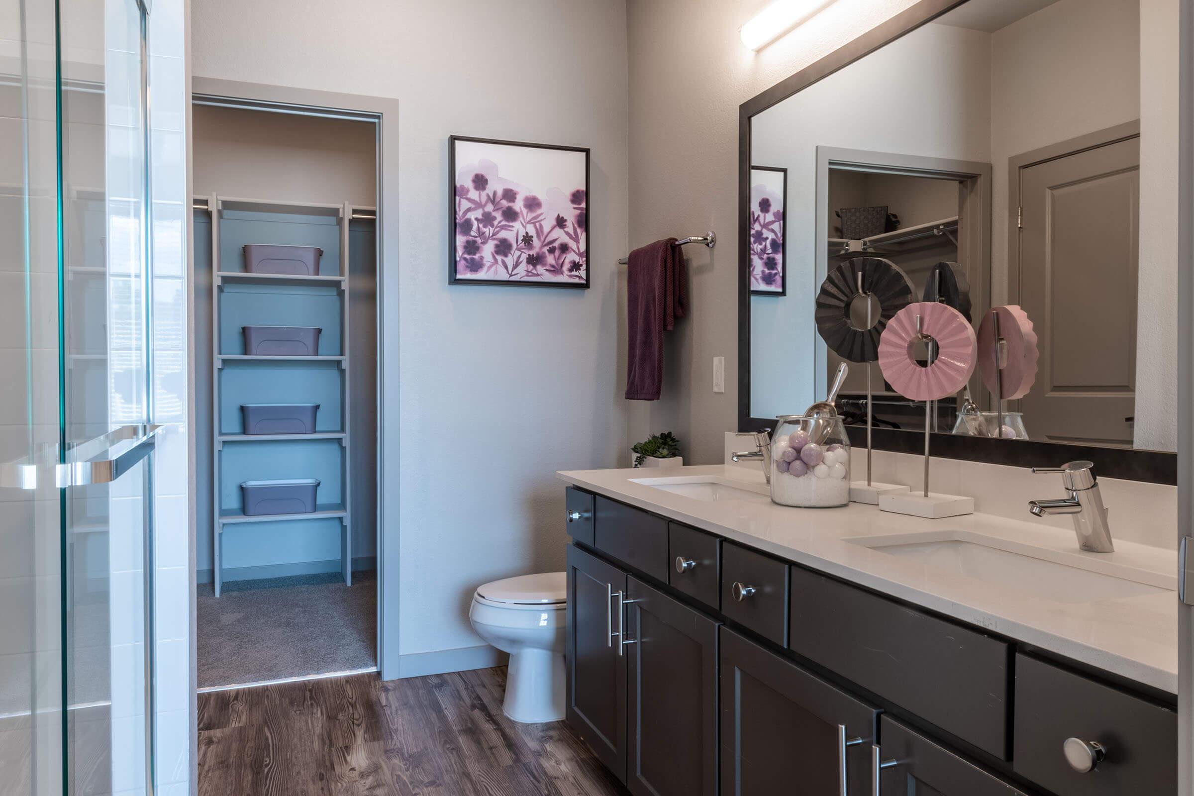 a kitchen with a sink and a mirror