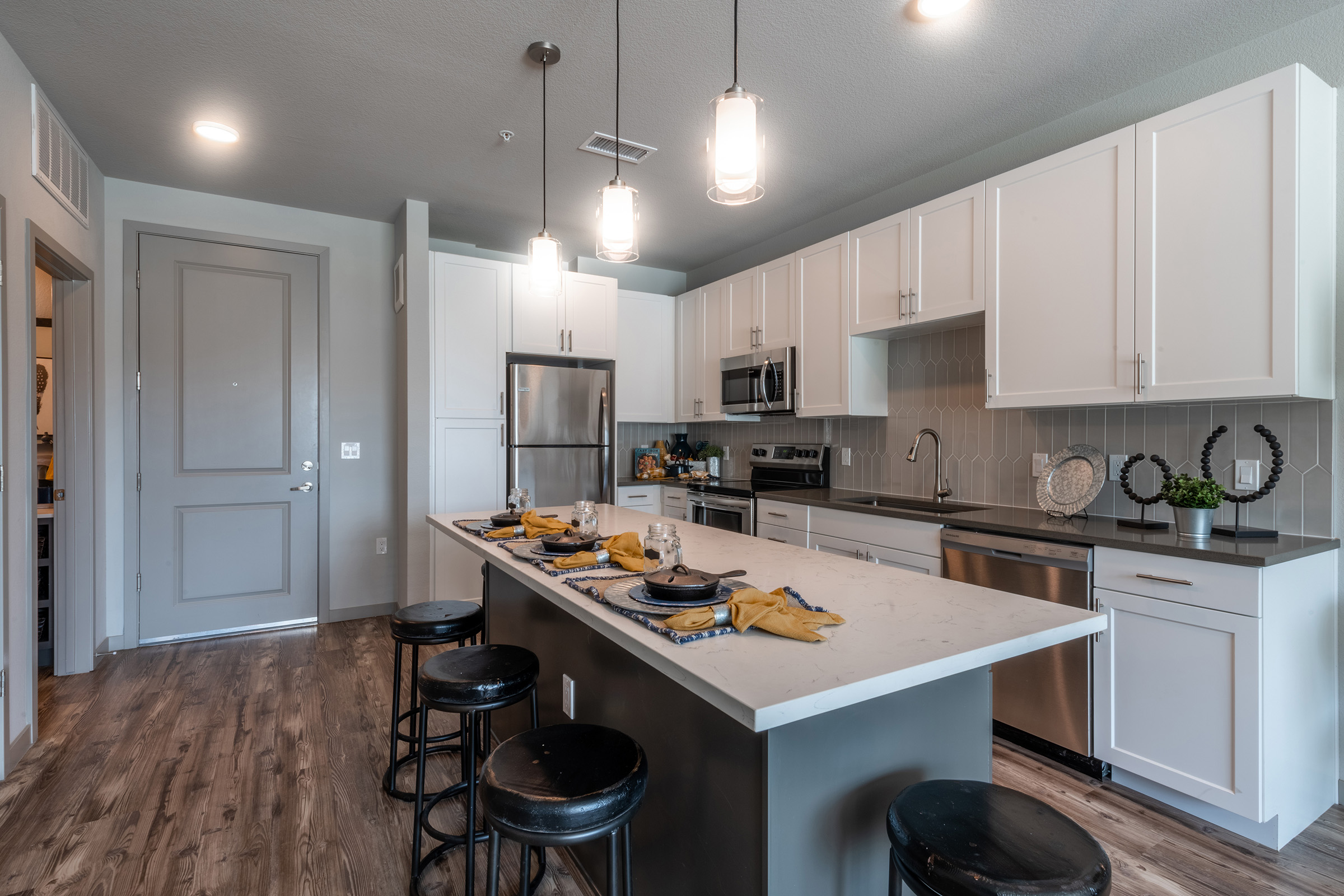 a modern kitchen with stainless steel appliances