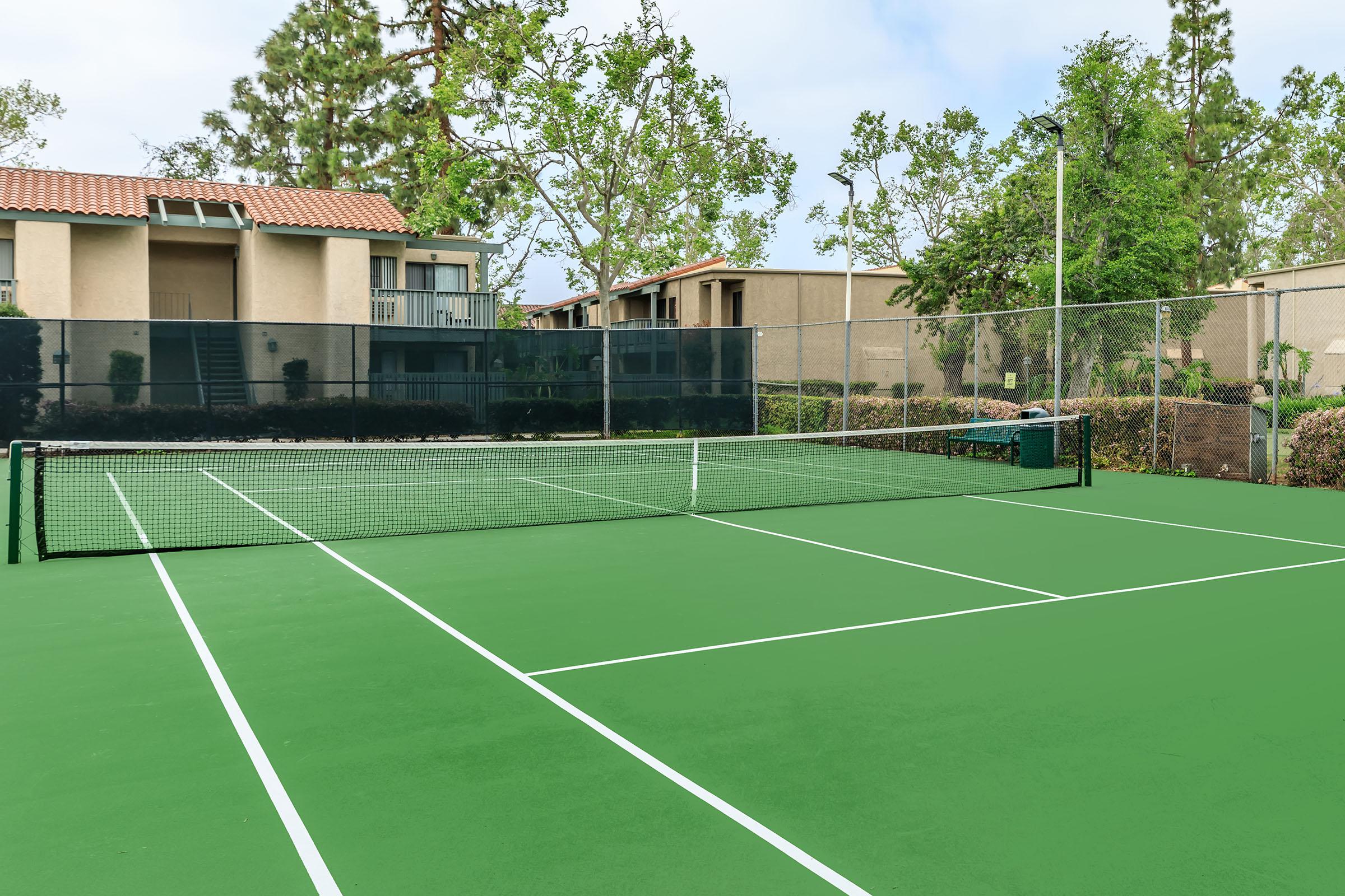 a house that has a racket in front of a building