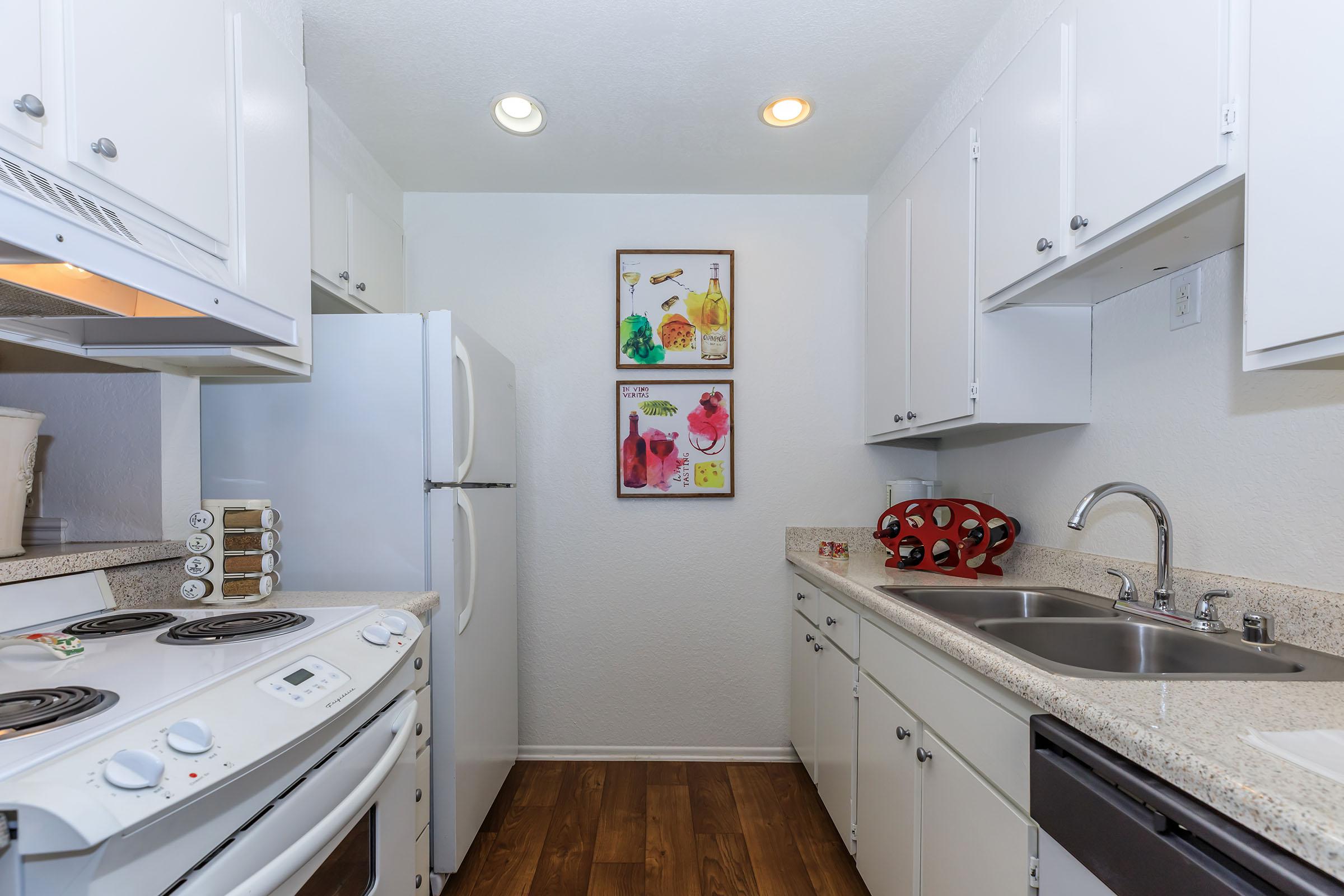 a kitchen with a stove and a sink