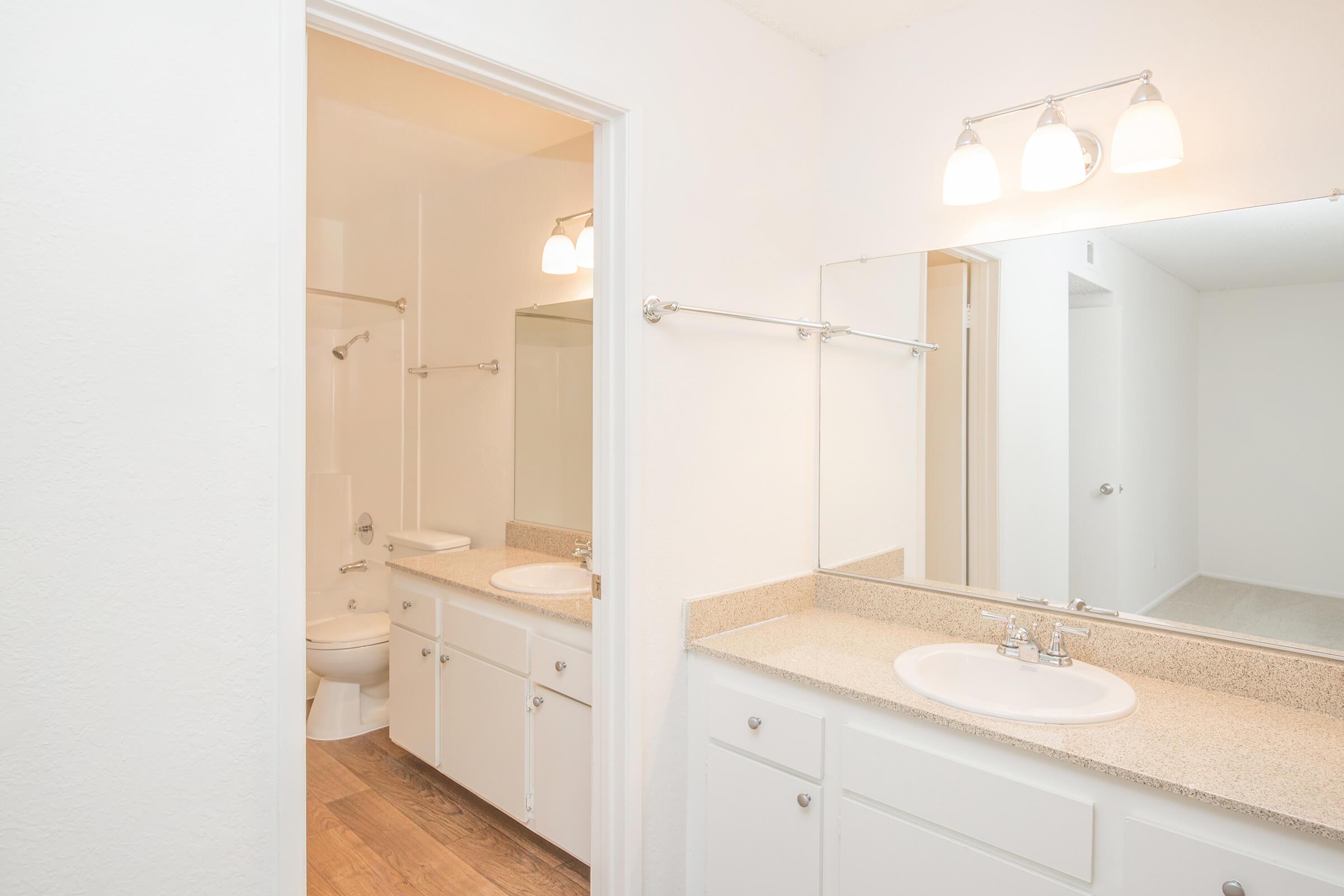 Bathroom sinks with white cabinets