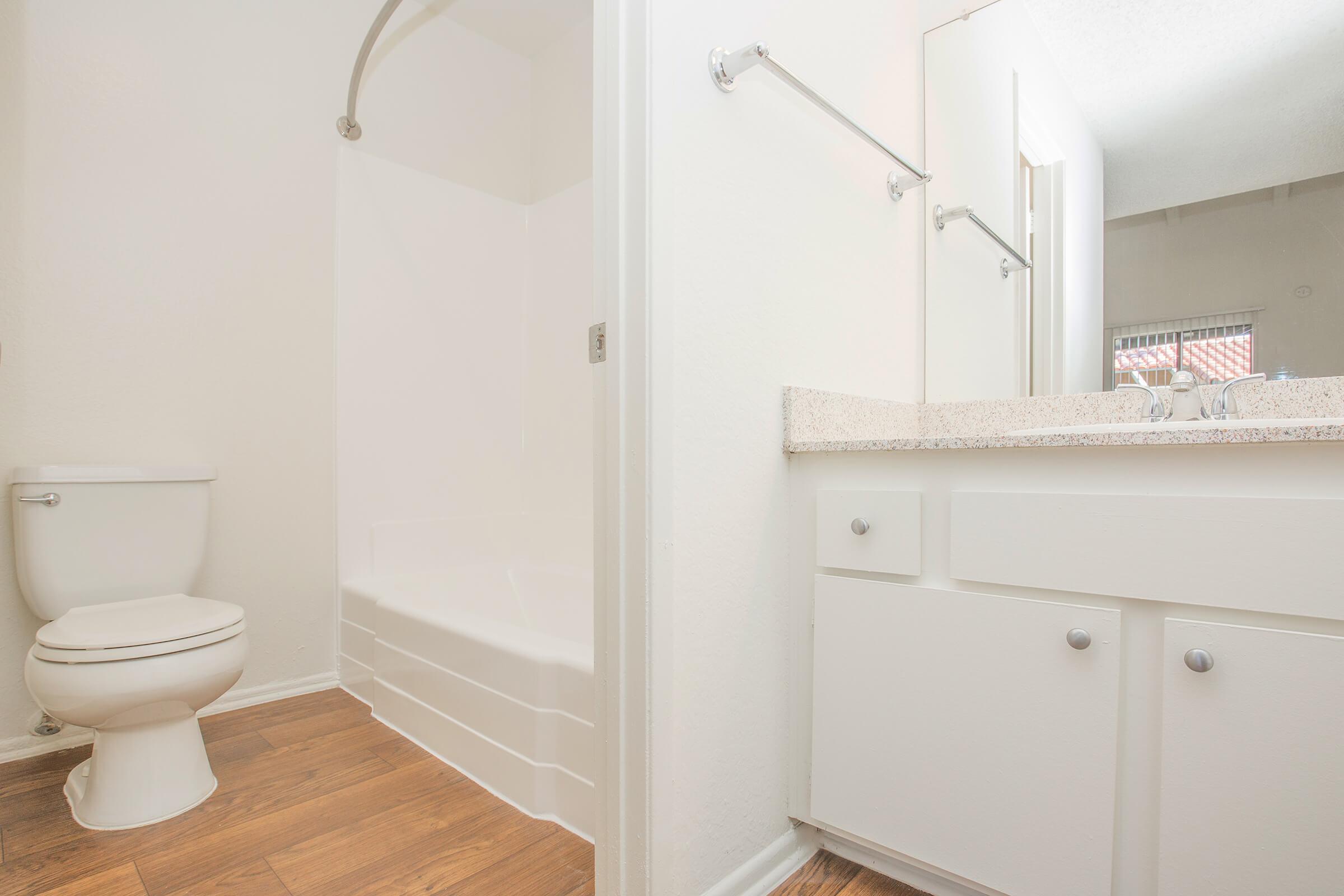 Unfurnished bathroom with wooden floors