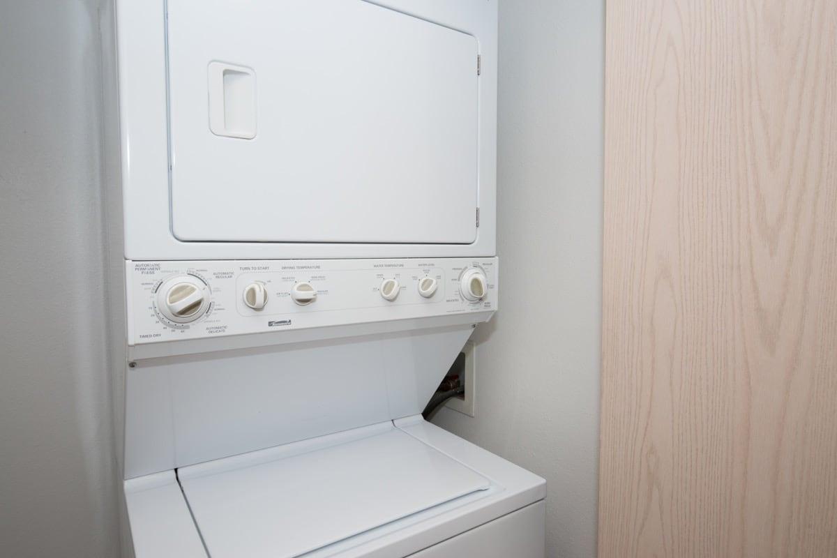 a white microwave oven sitting on top of a door