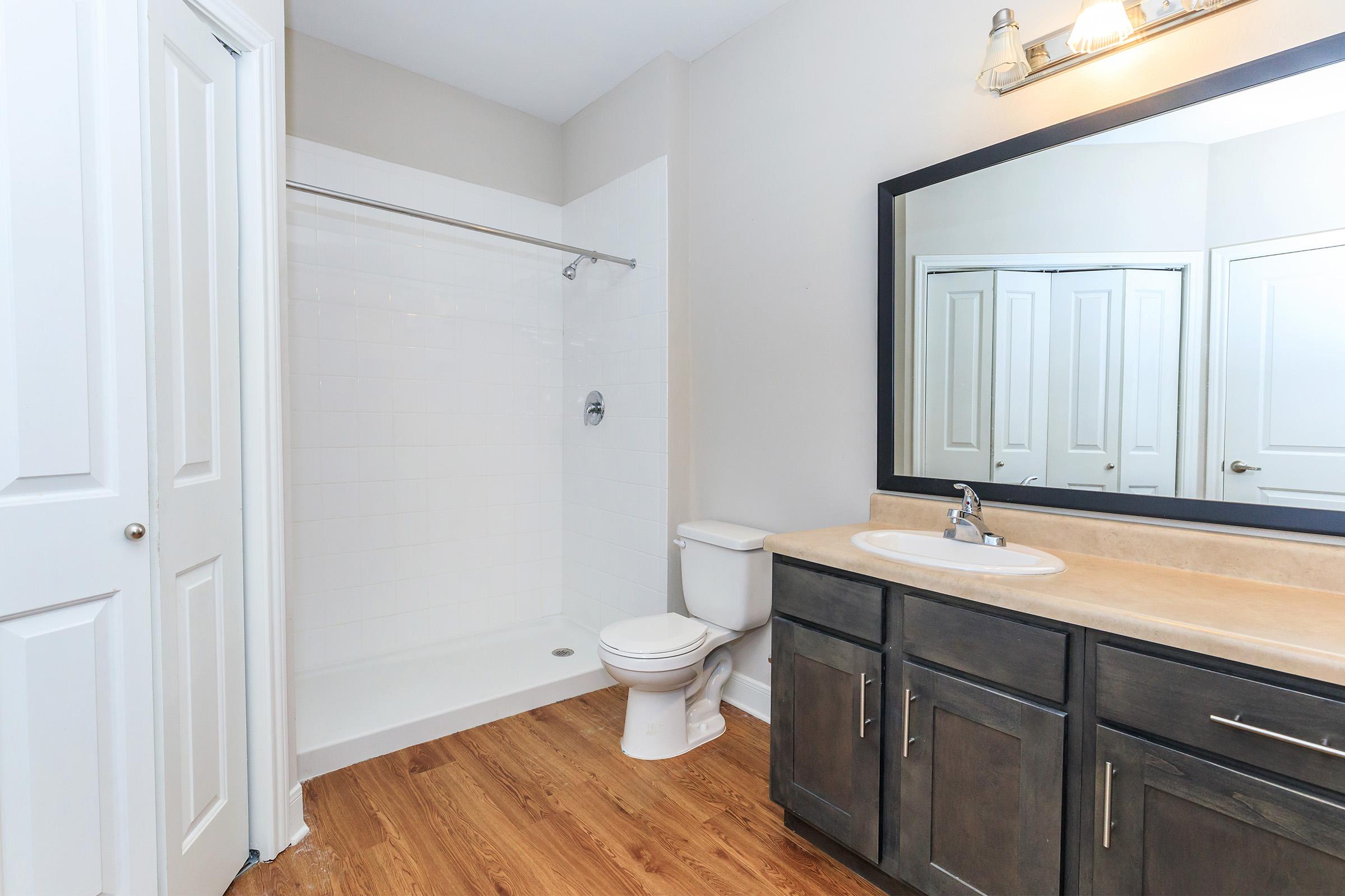 a kitchen with a sink and a mirror