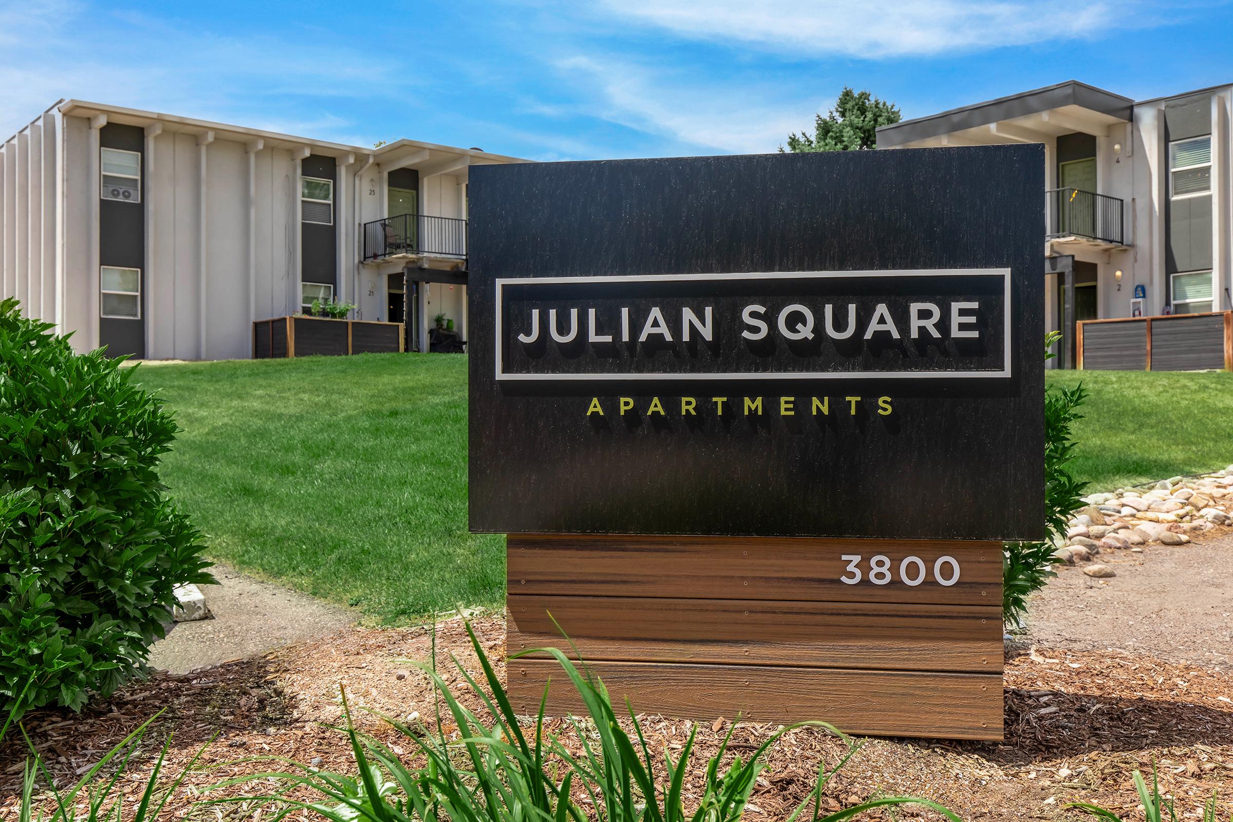 a sign in front of a house