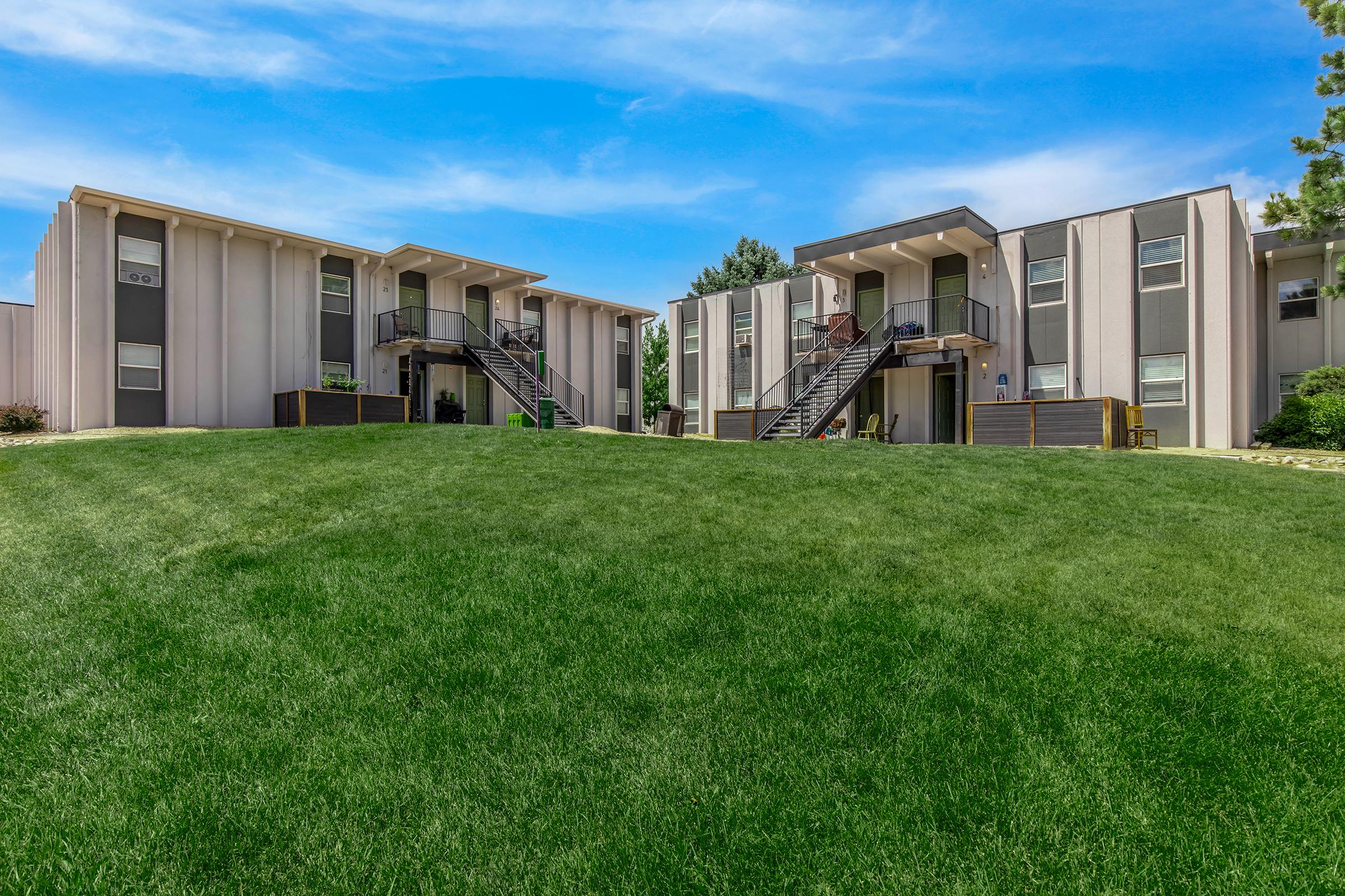 a large lawn in front of a building