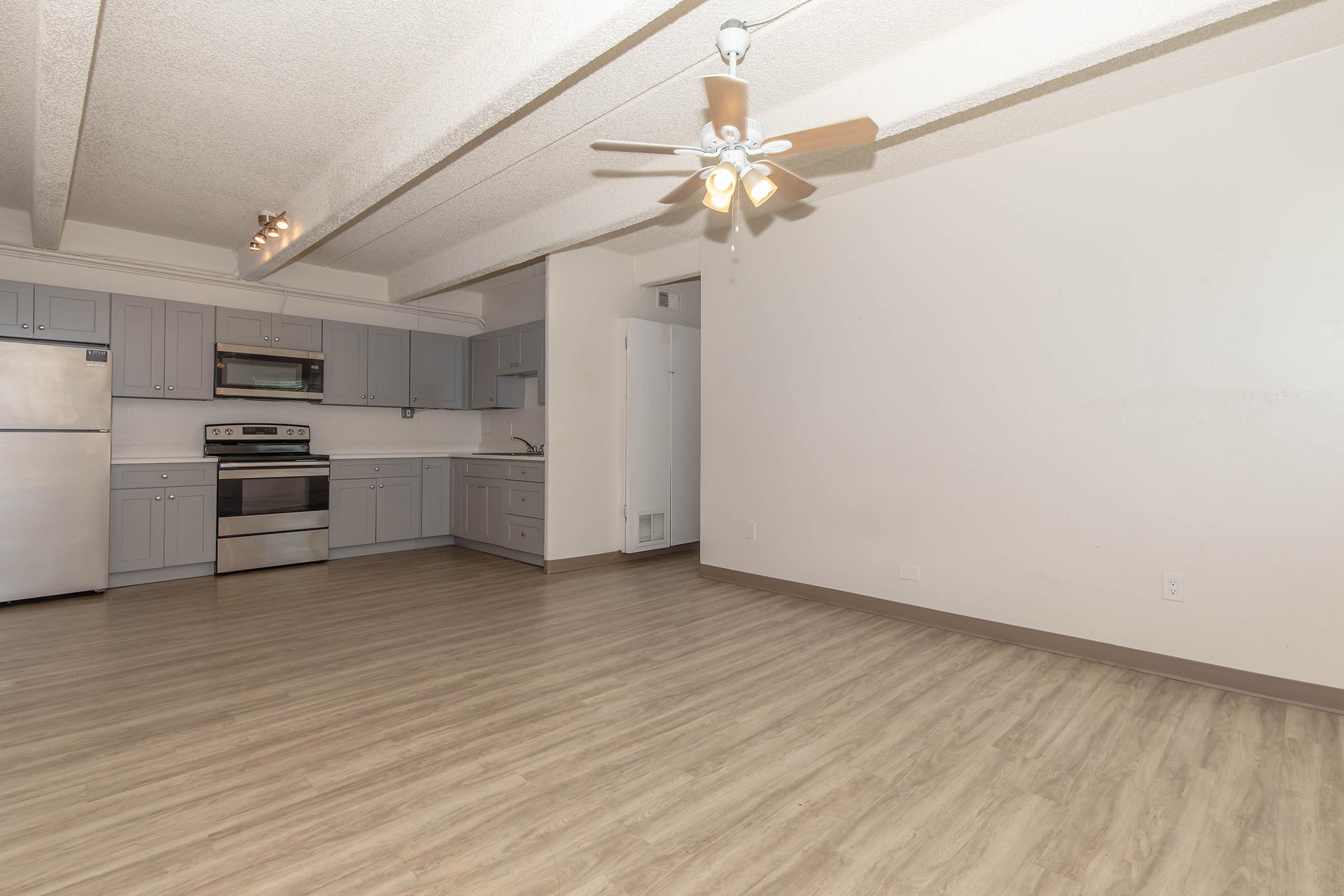 a kitchen with a wooden floor