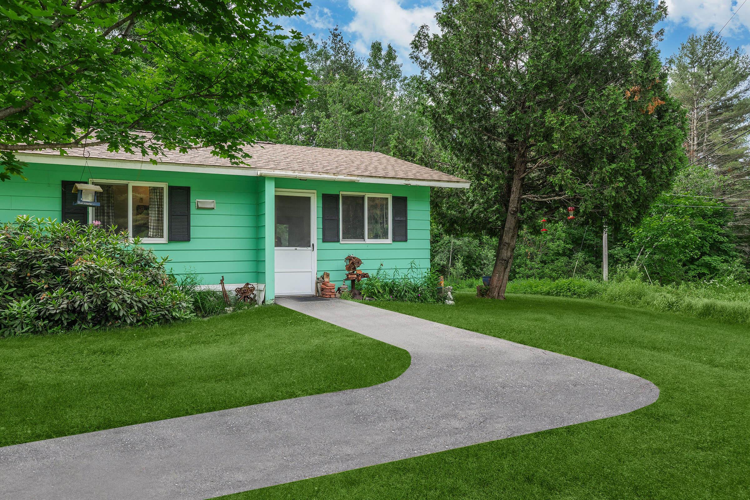 a green lawn in front of a house