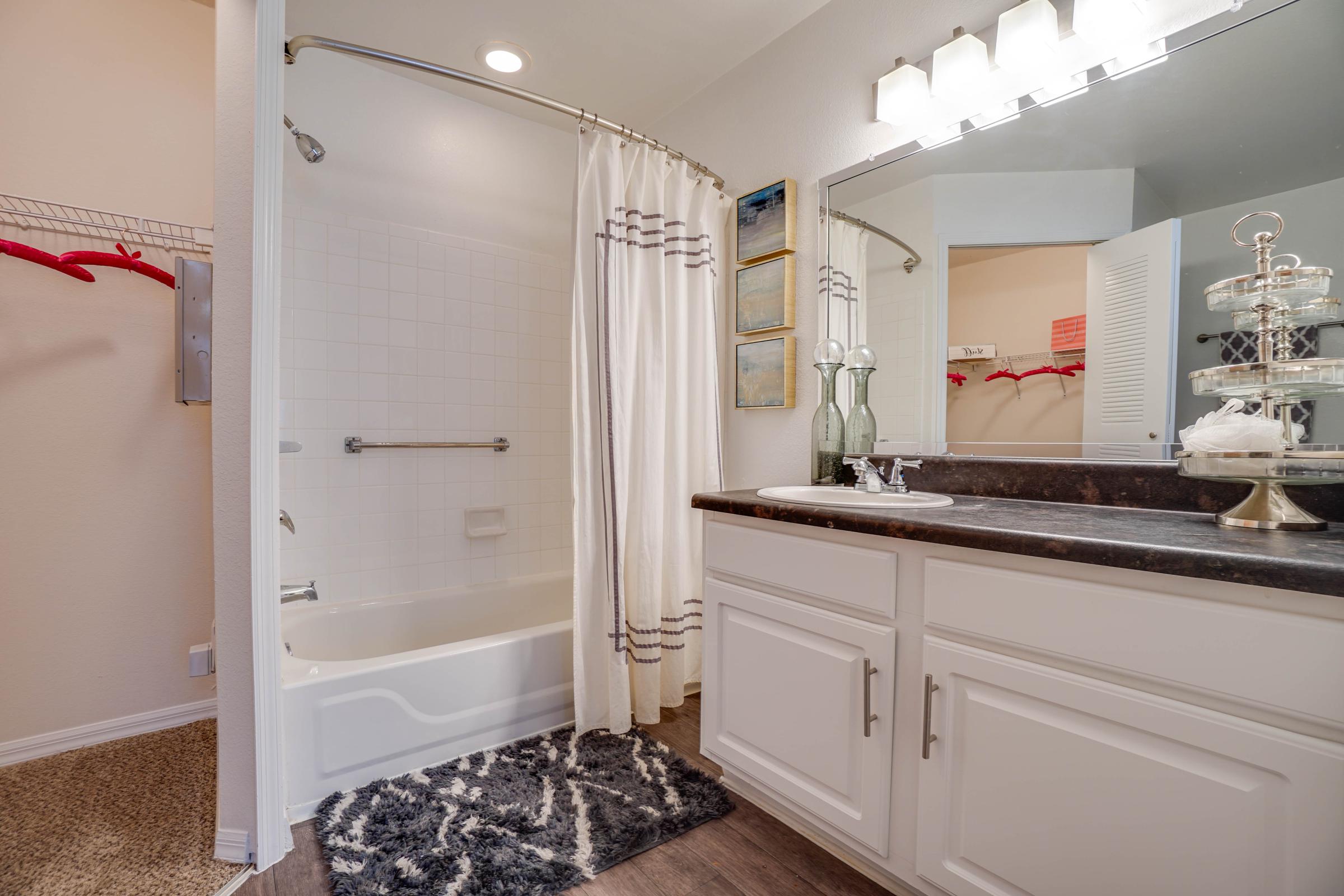 a kitchen with a sink and a mirror