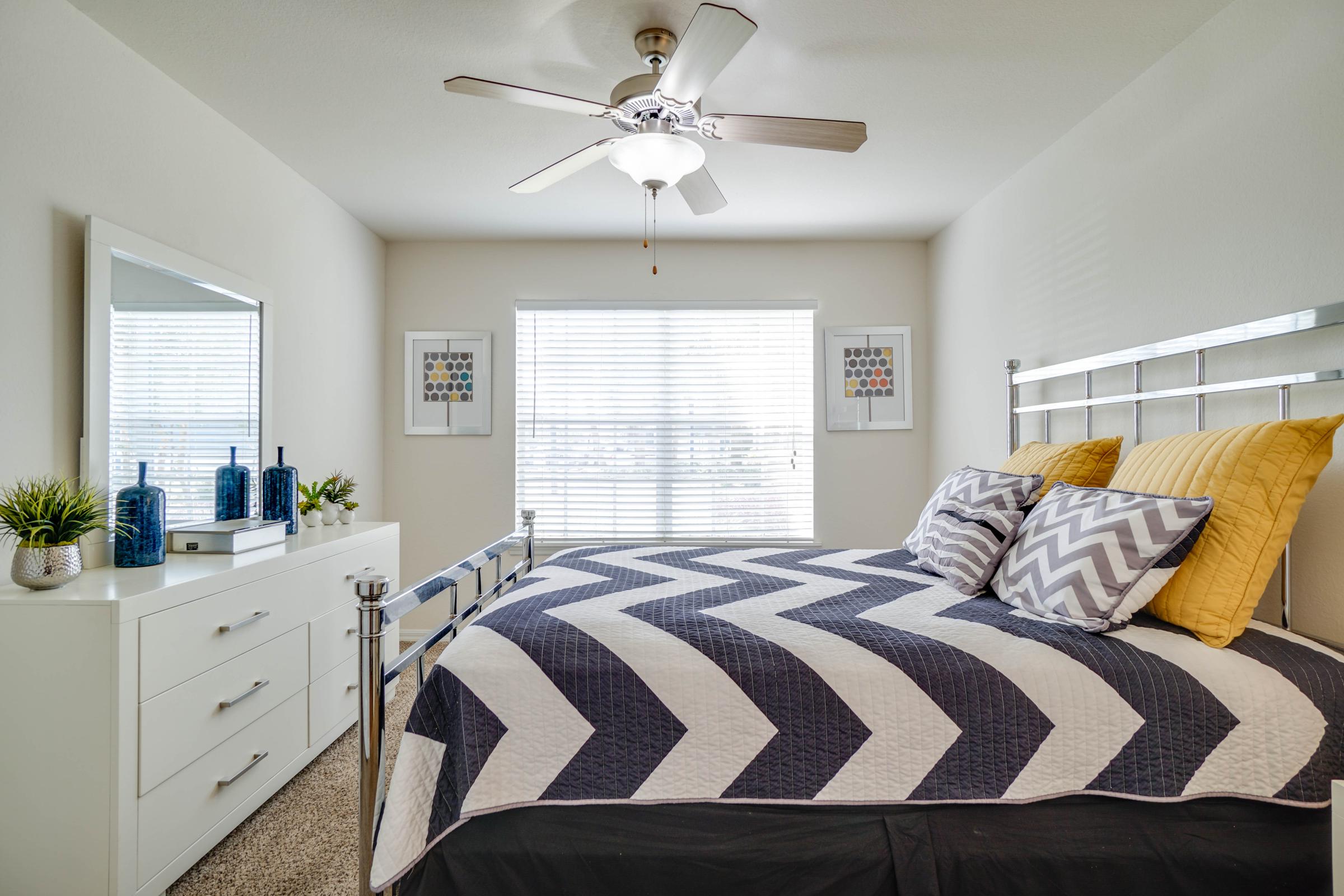 a bedroom with a large bed in a room