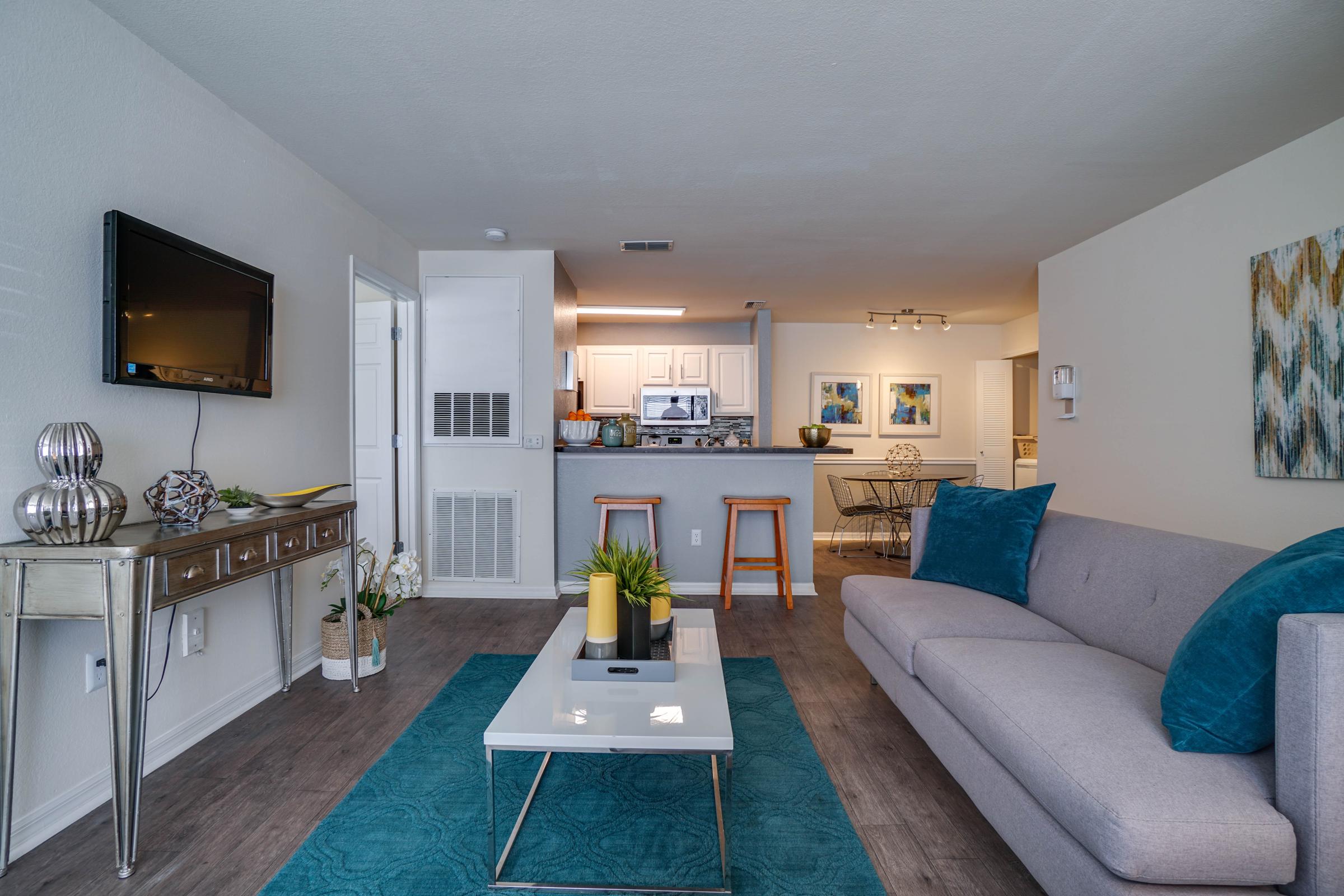 a living room filled with furniture and a tv