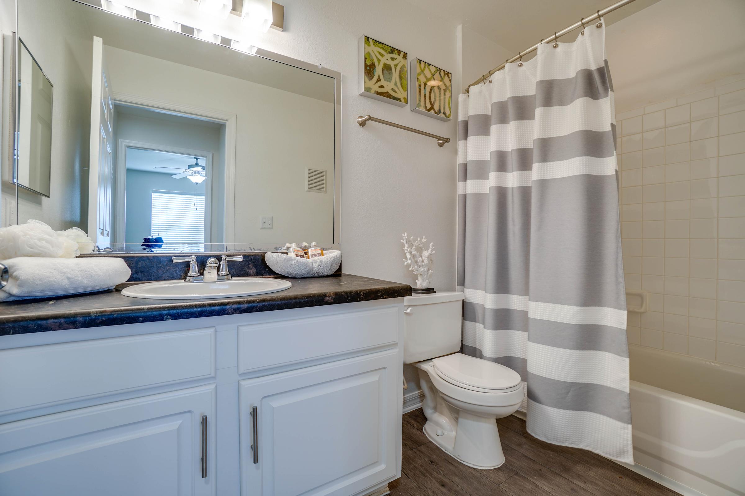 a kitchen with a sink and a mirror