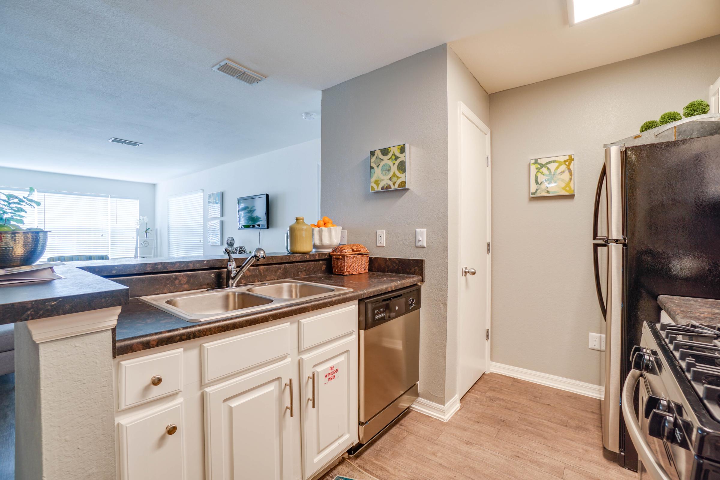 a kitchen with a sink and a microwave