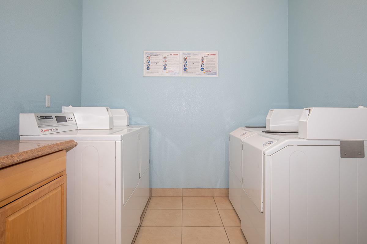 a white refrigerator freezer sitting inside of a kitchen