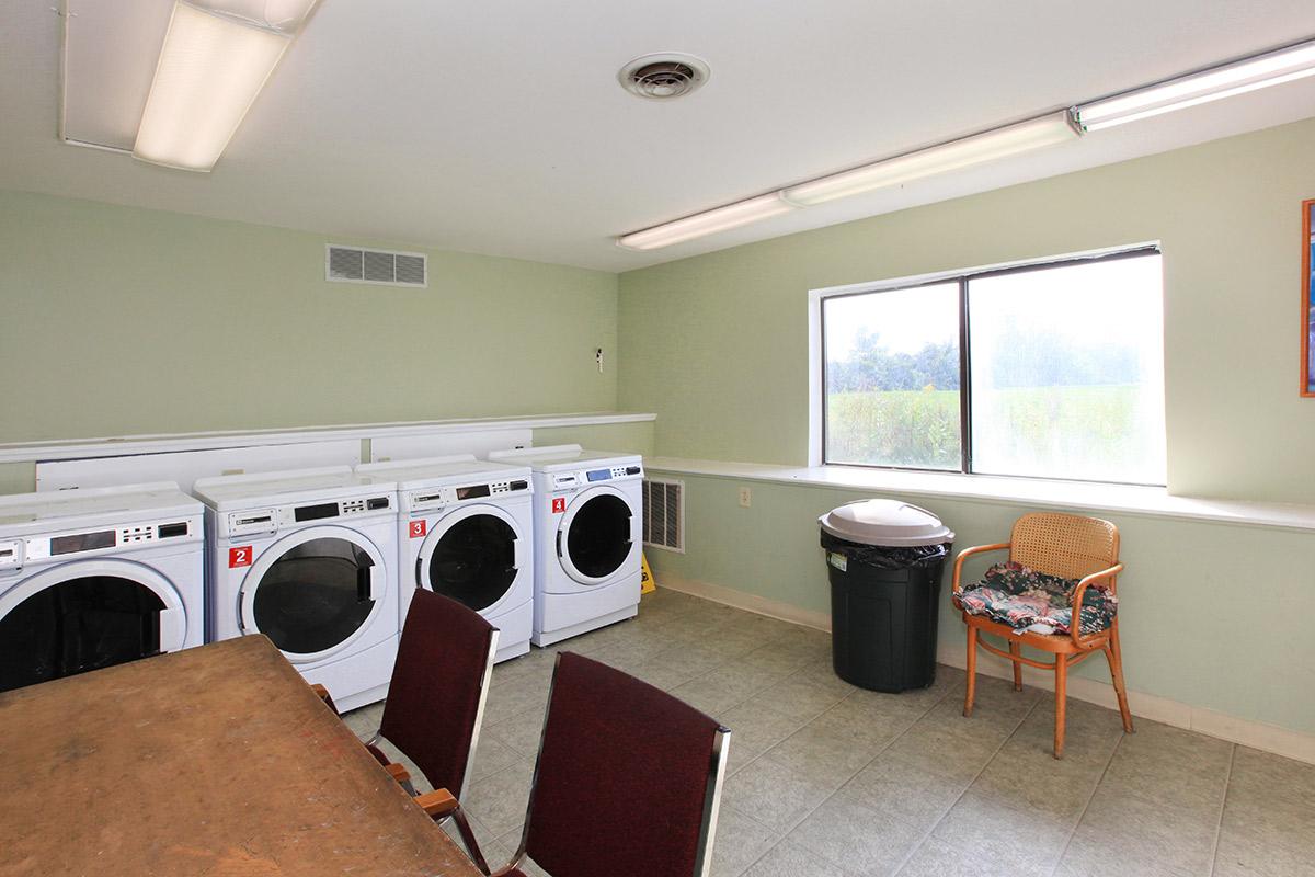 a kitchen with a stove top oven sitting inside of a room