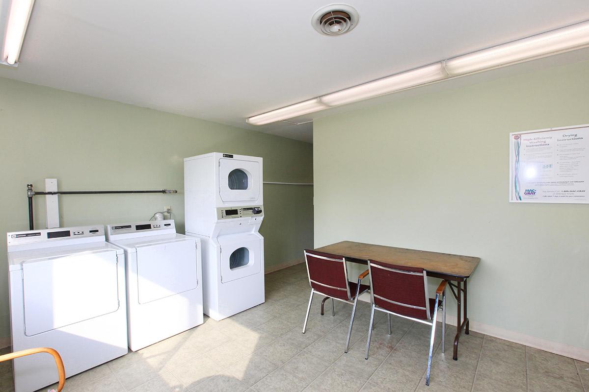 a kitchen with a stove top oven sitting inside of a room