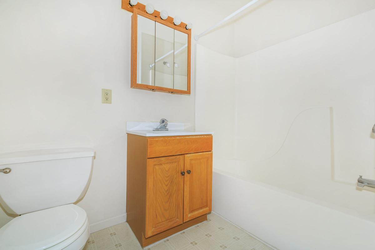 a kitchen with a sink and a mirror