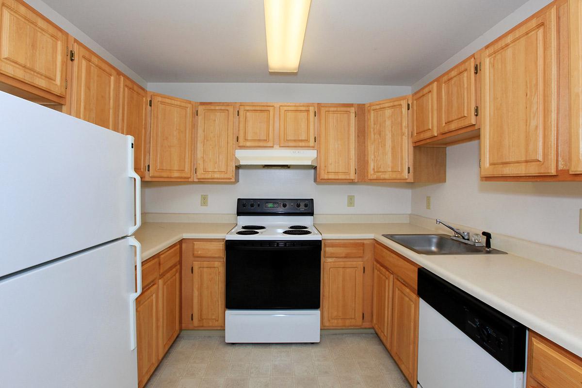 a kitchen with a refrigerator stove and microwave