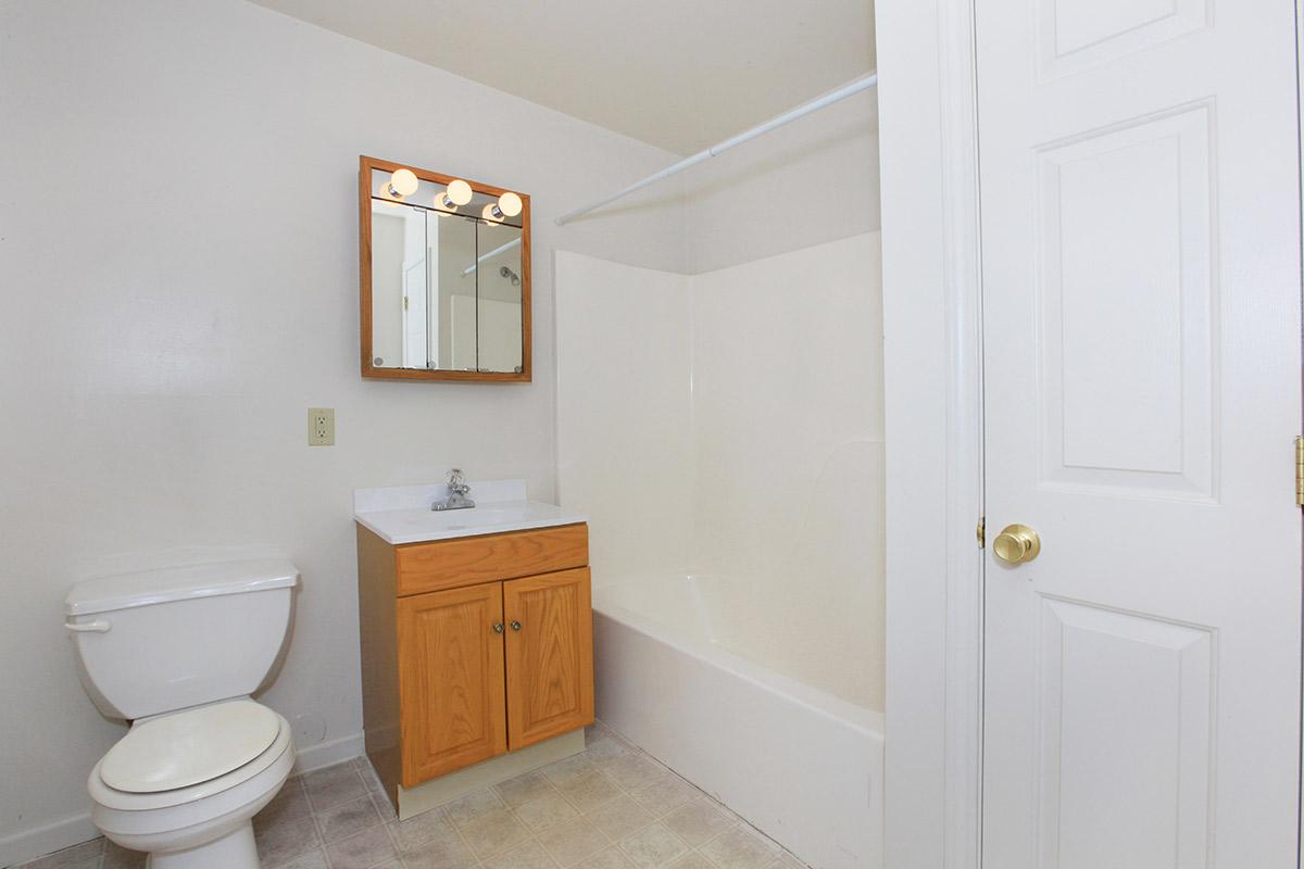 a white sink sitting next to a door