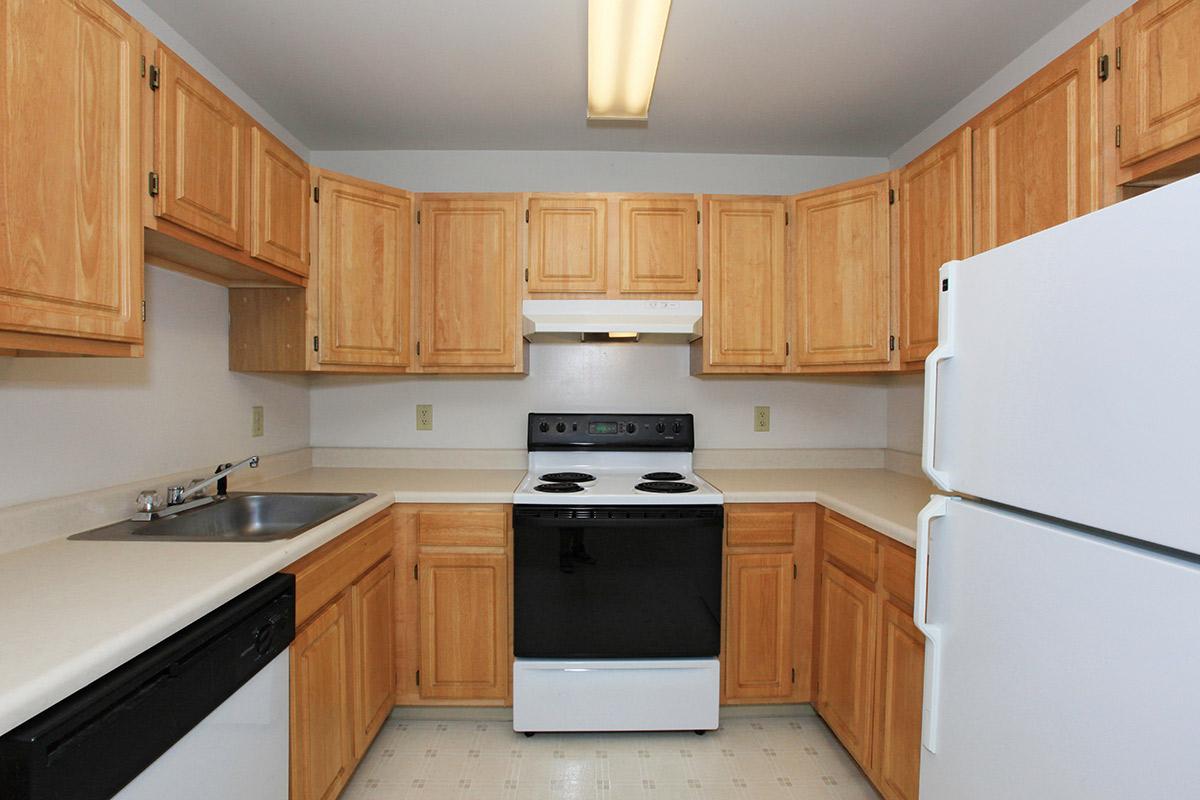 a kitchen with a refrigerator stove and microwave