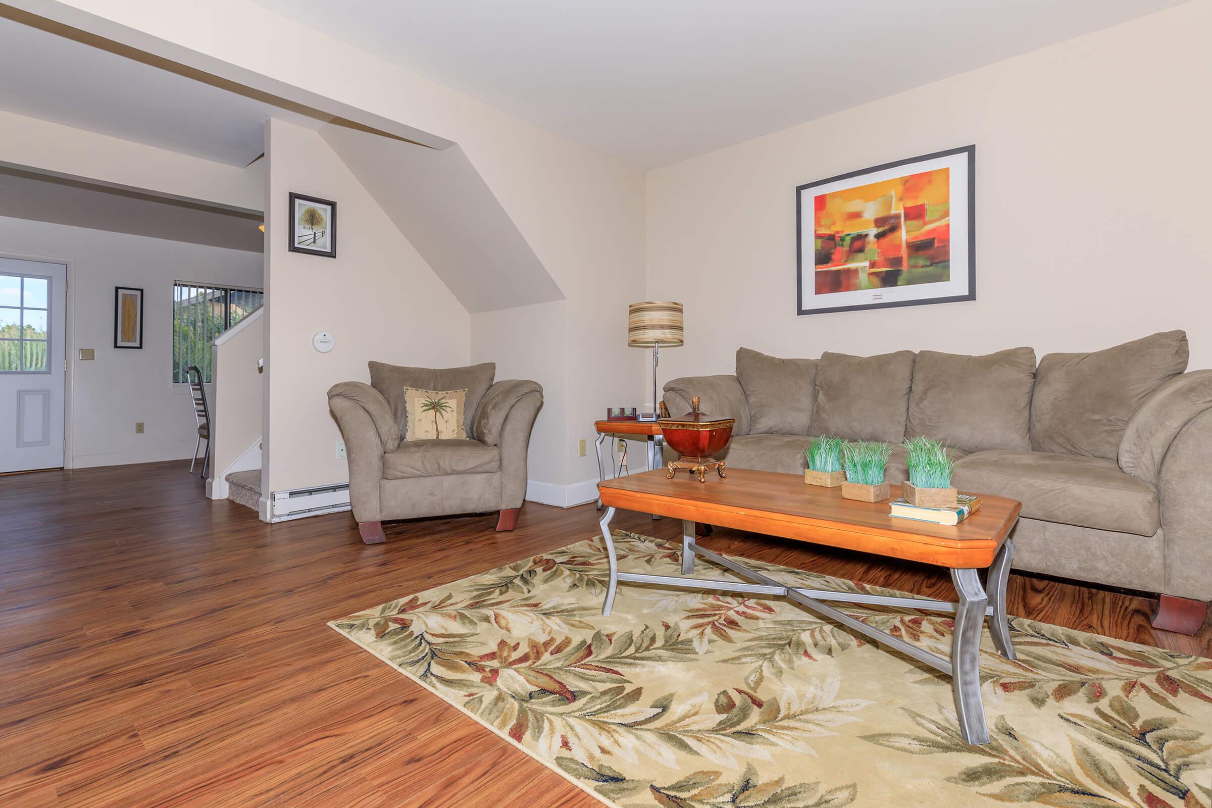 a living room filled with furniture and a fireplace