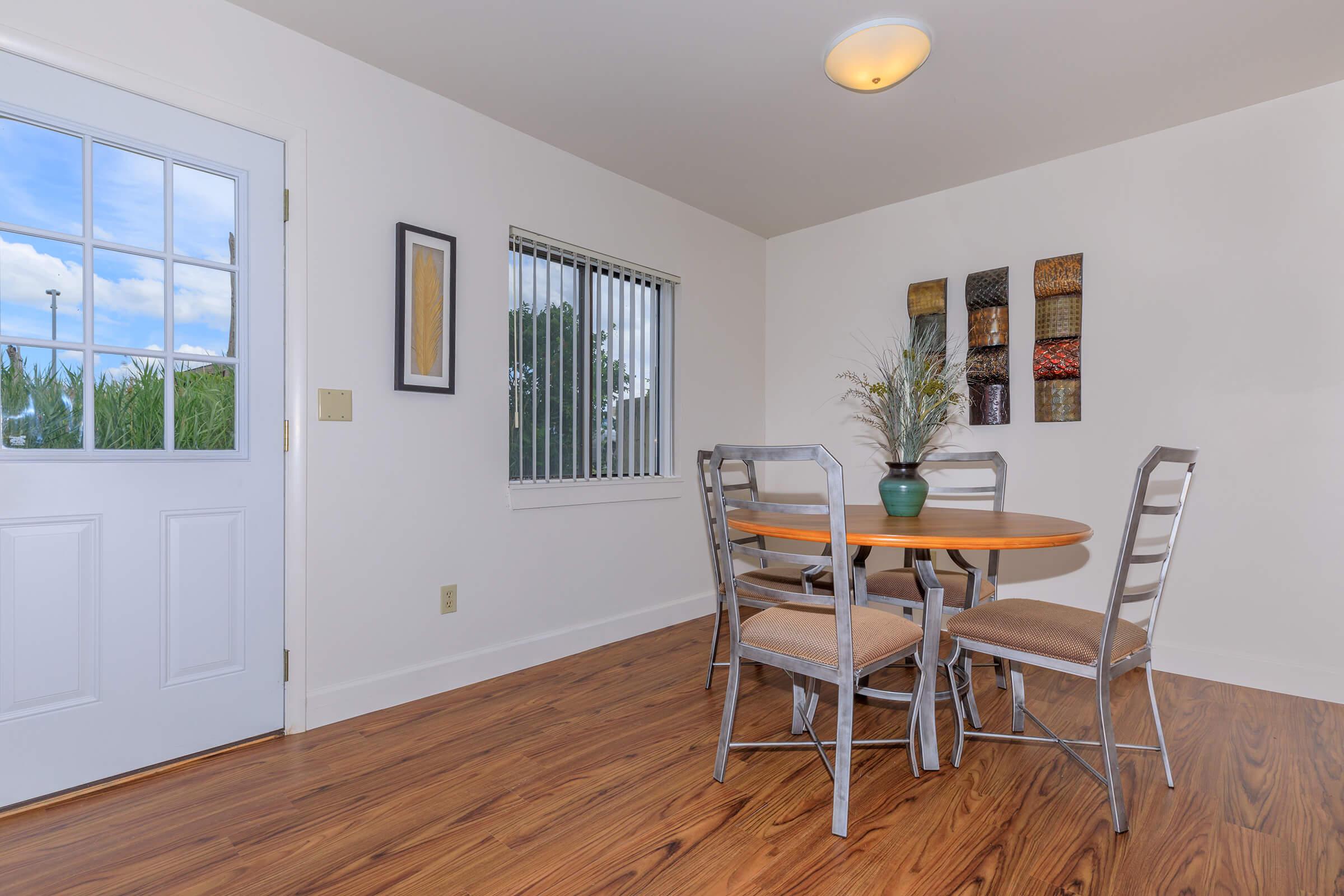 a living room filled with furniture and a large window