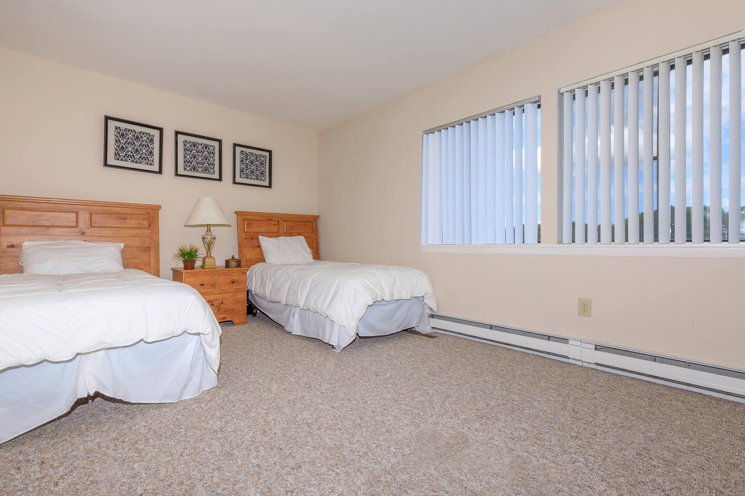 a bedroom with a large bed in a room