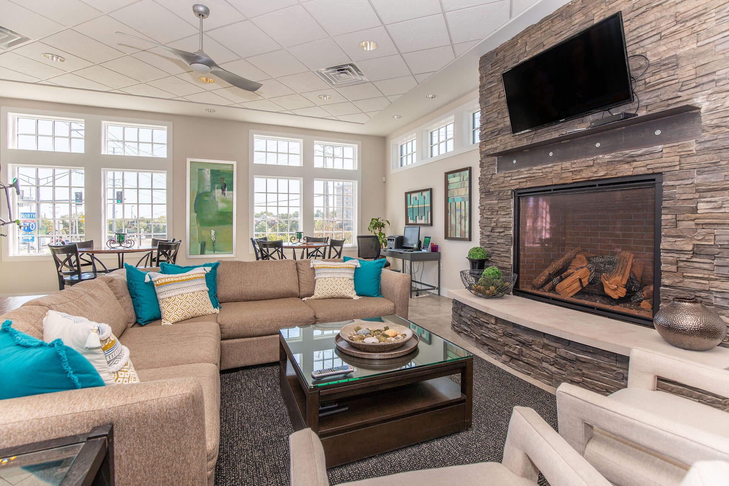 a living room filled with furniture and a fire place