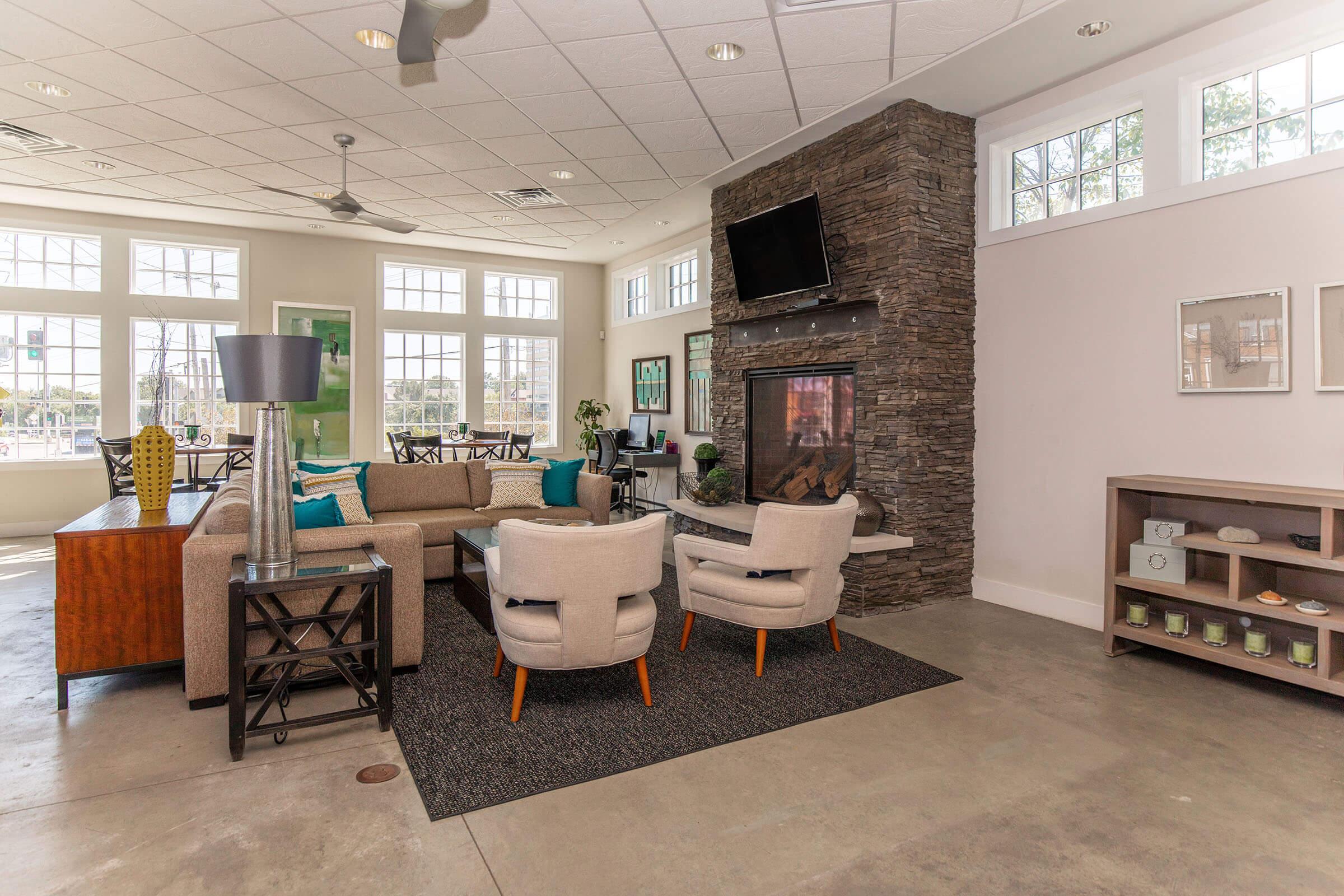 a living room filled with furniture and a large window