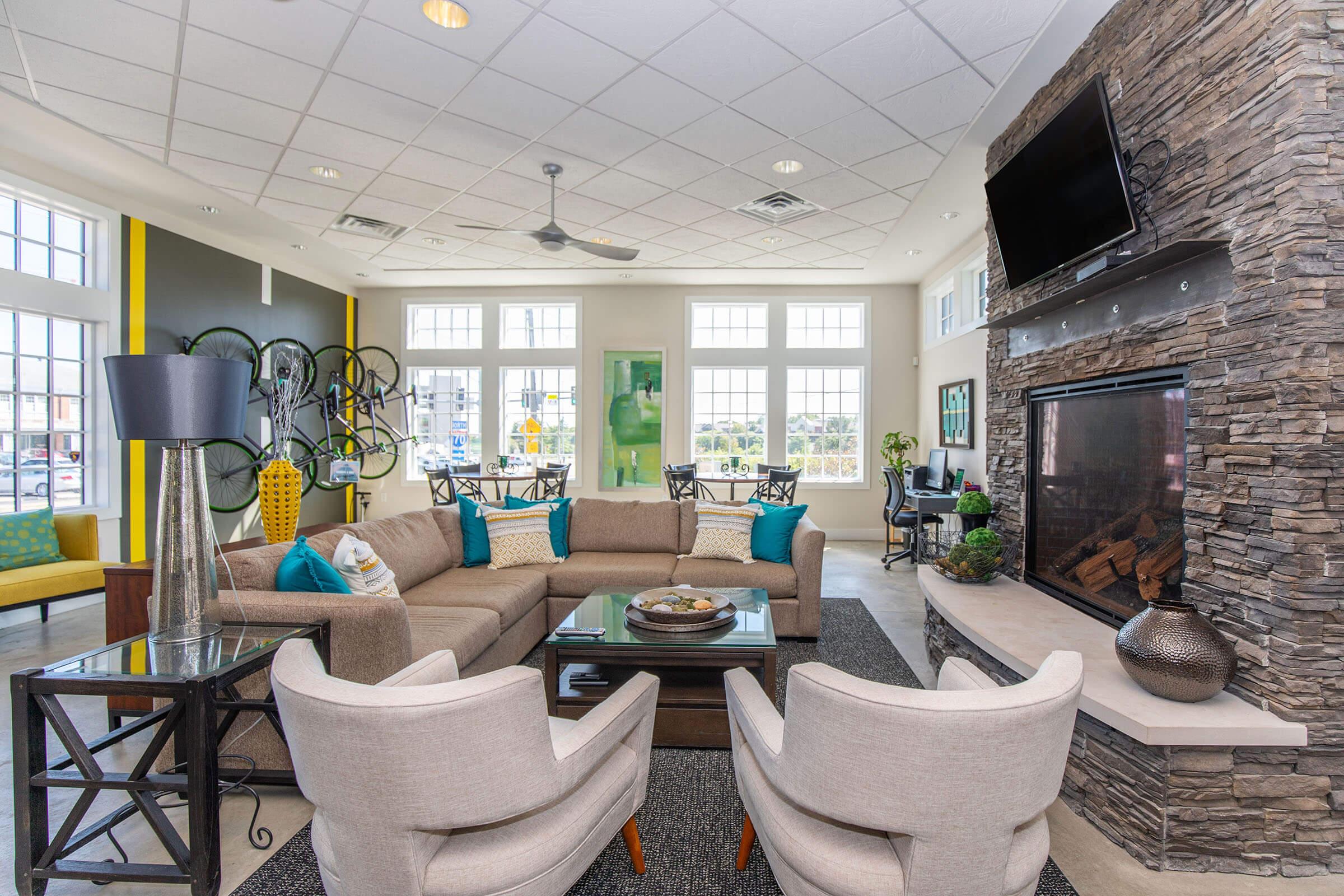 a living room filled with furniture and a fireplace