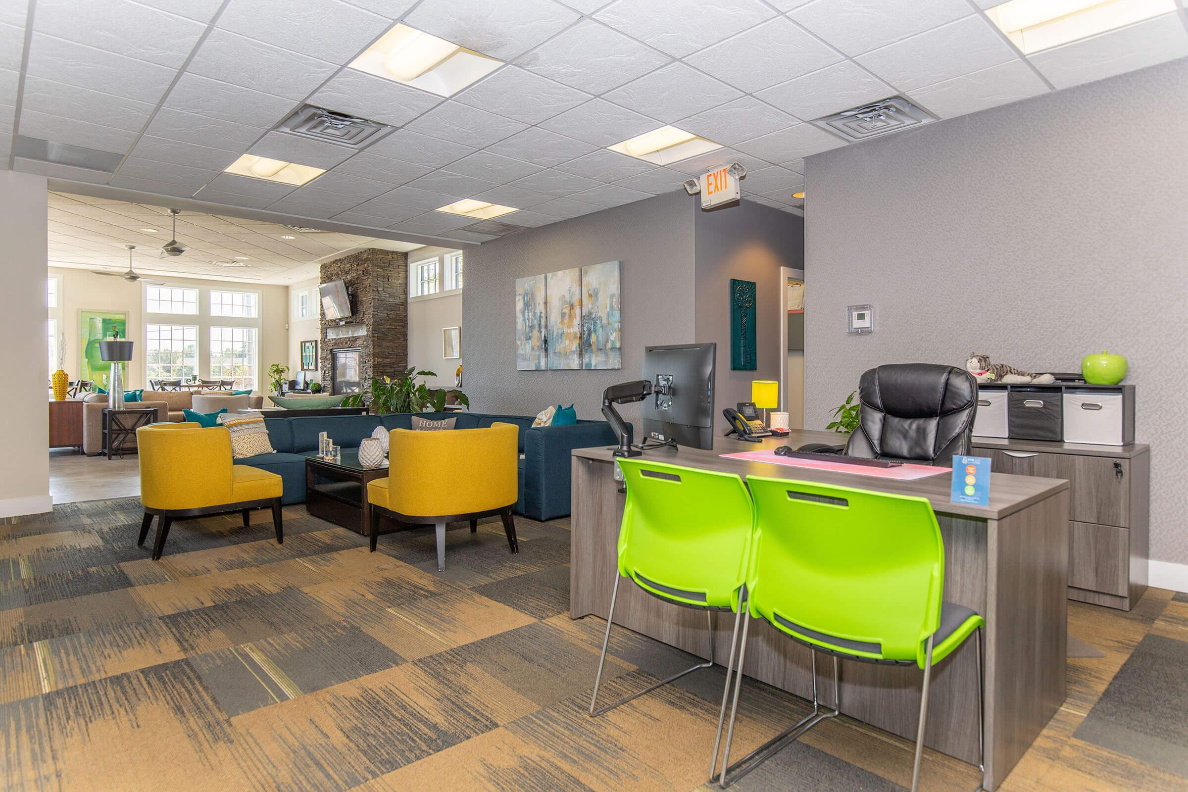 an office with a desk and chair in a room