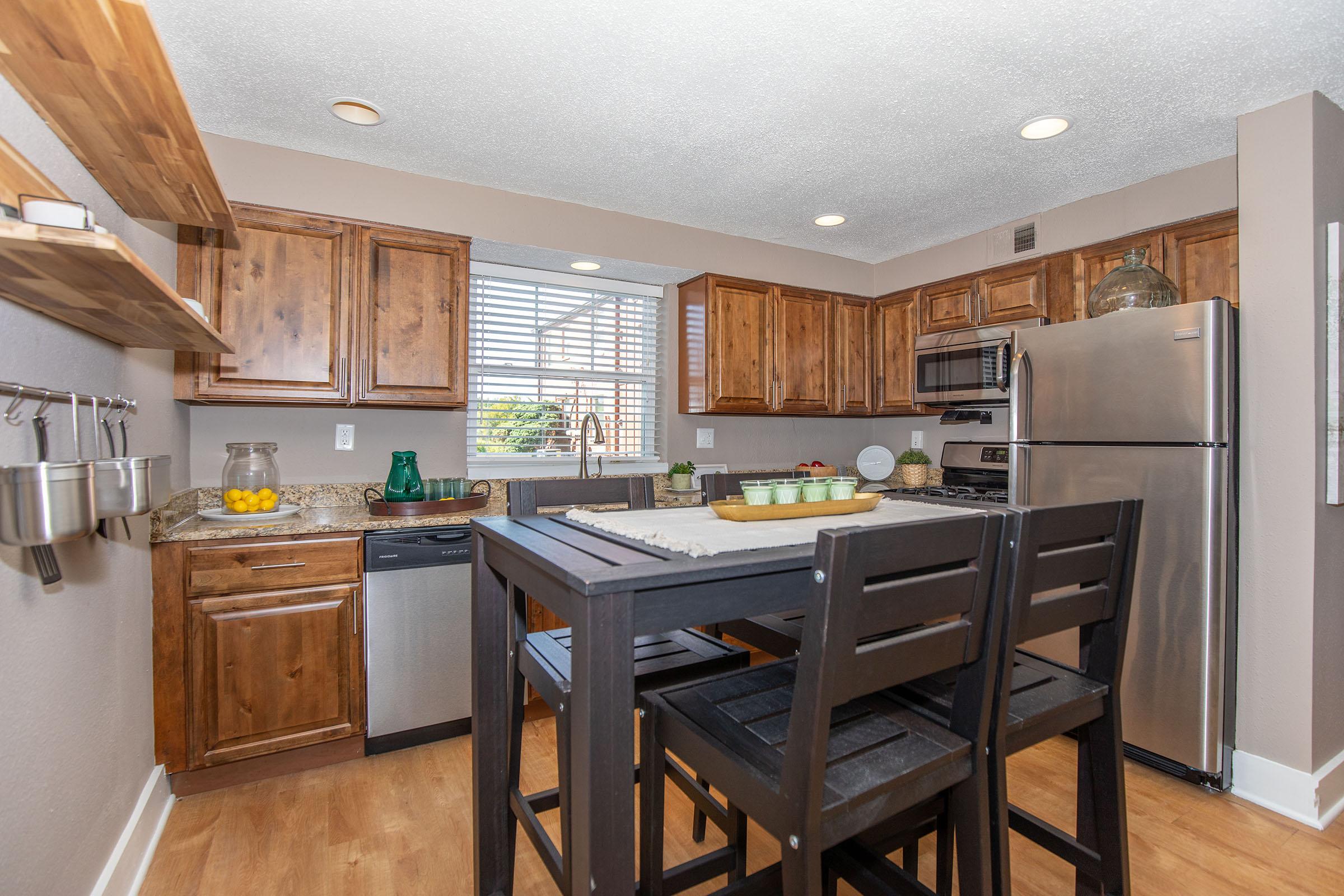 a kitchen with a dining table