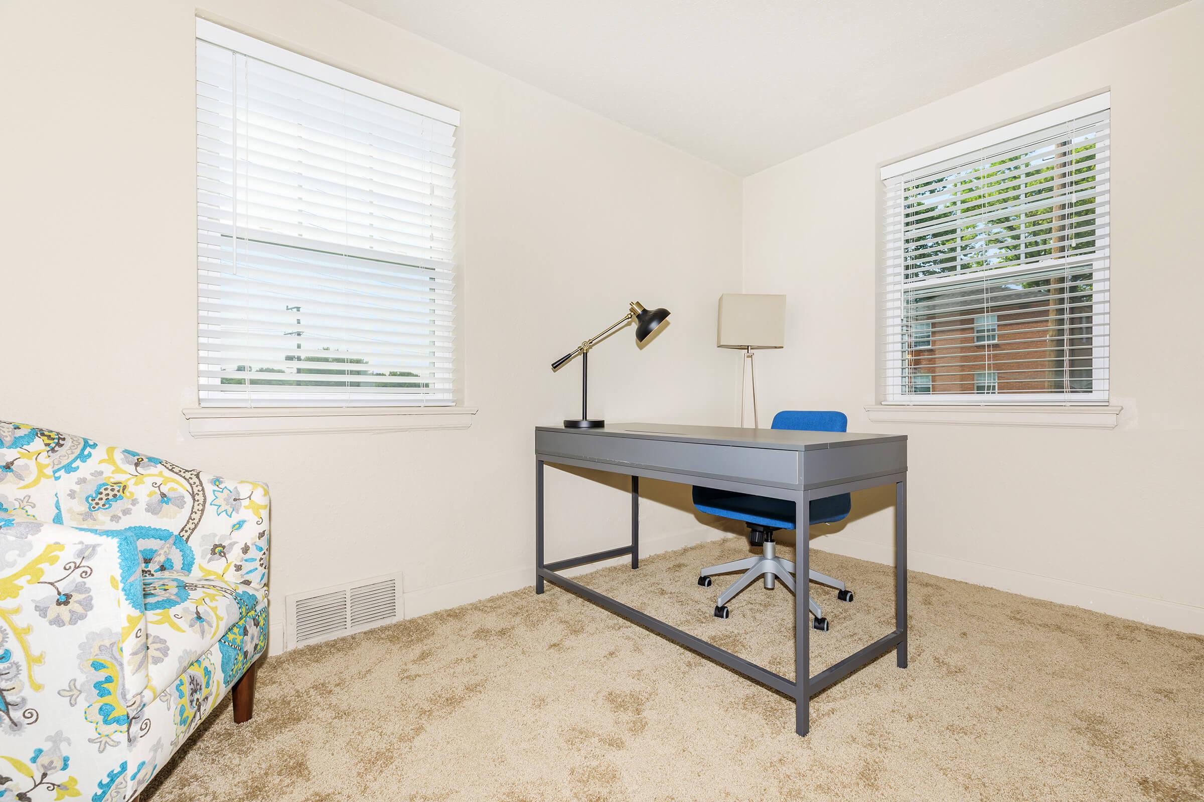 a bedroom with a bed in a room