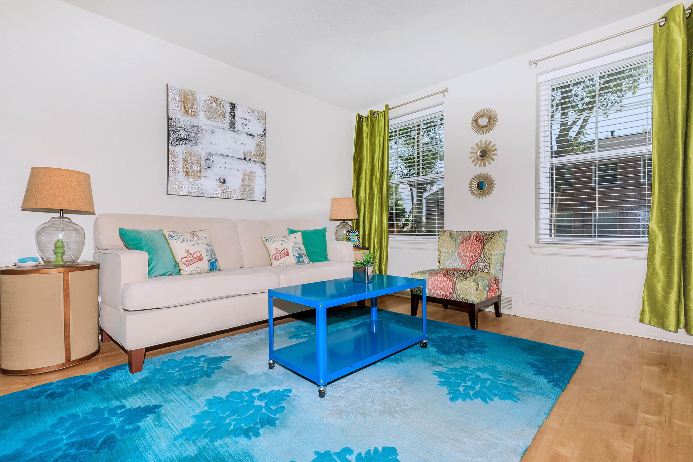 a living room filled with furniture and a pool table