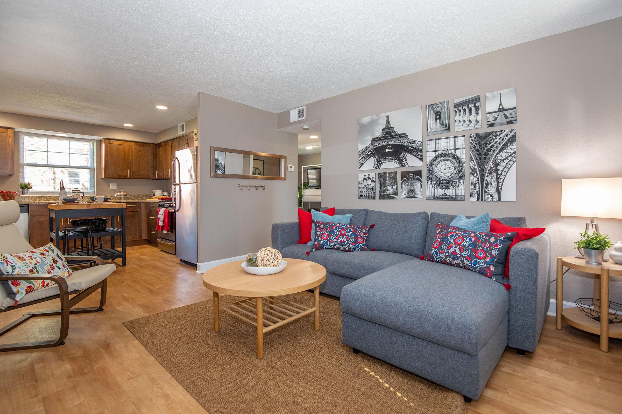 a living room filled with furniture and a table