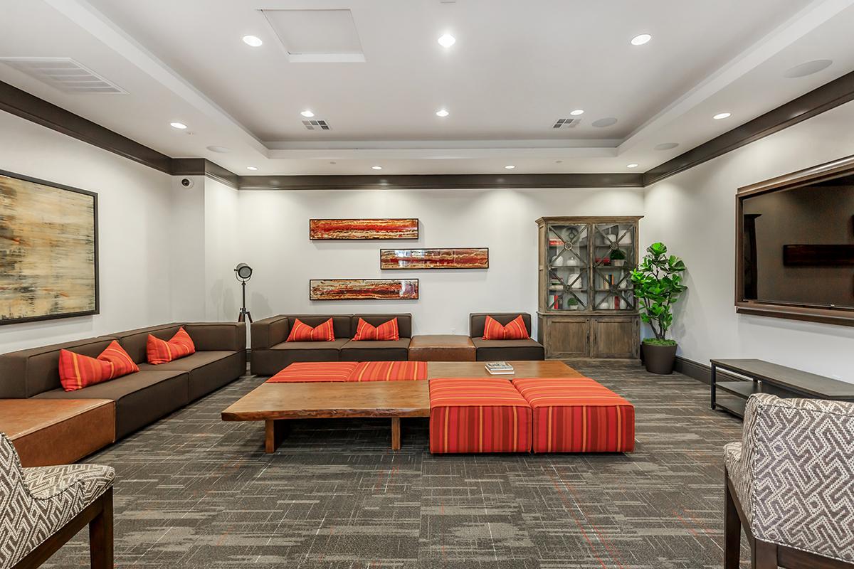 A community room with couches and TV