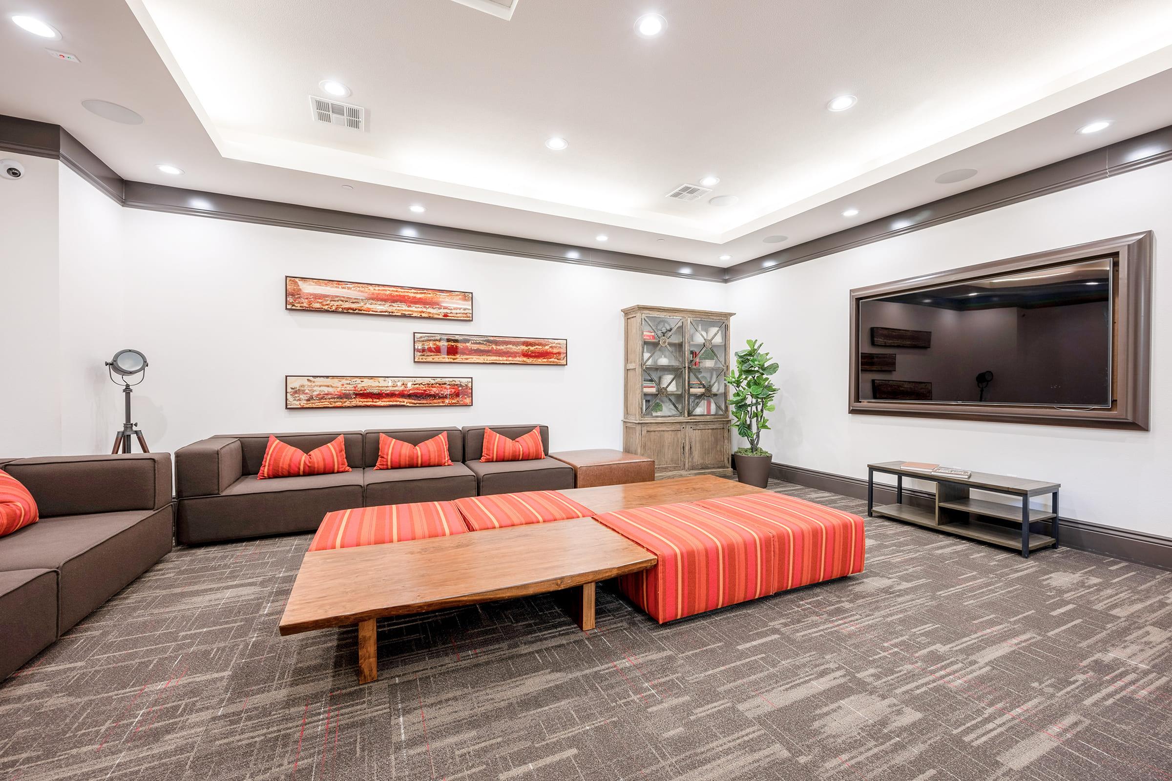 a bedroom with a bed and desk in a room