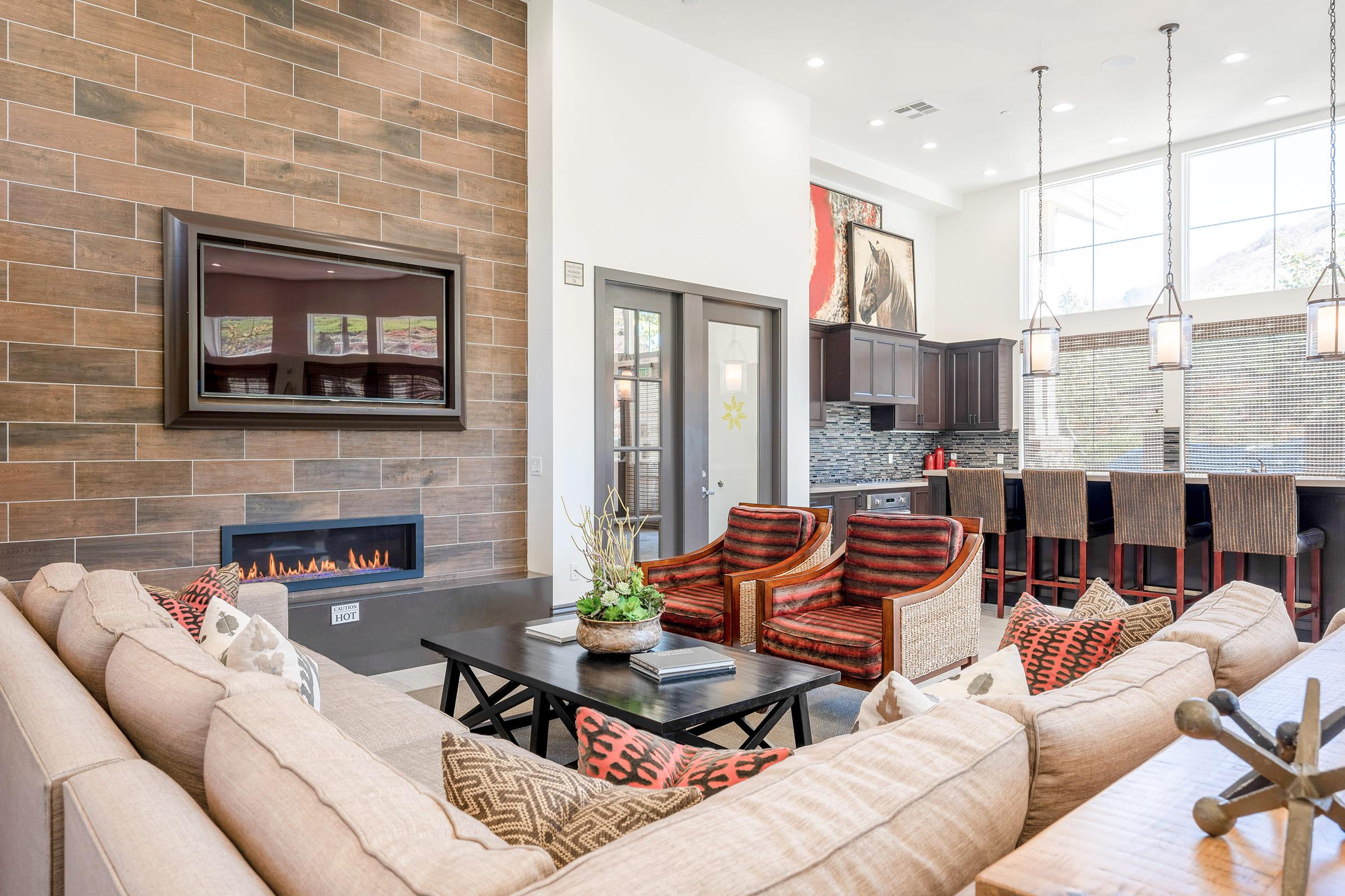 a living room filled with furniture and a fire place