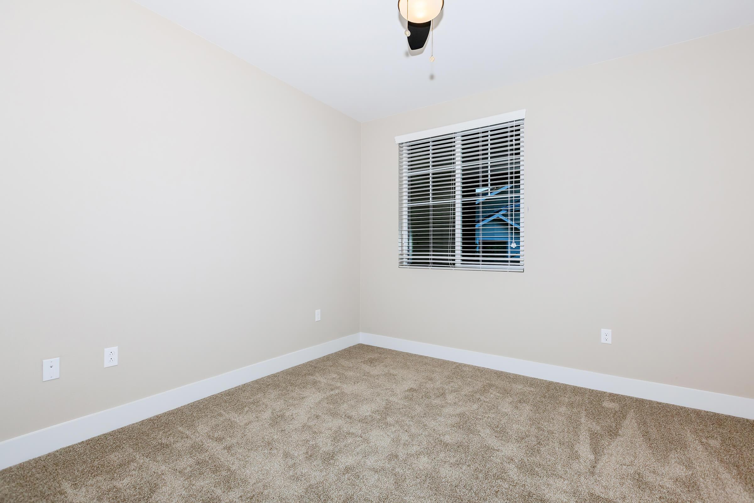 a room with a sink and a window