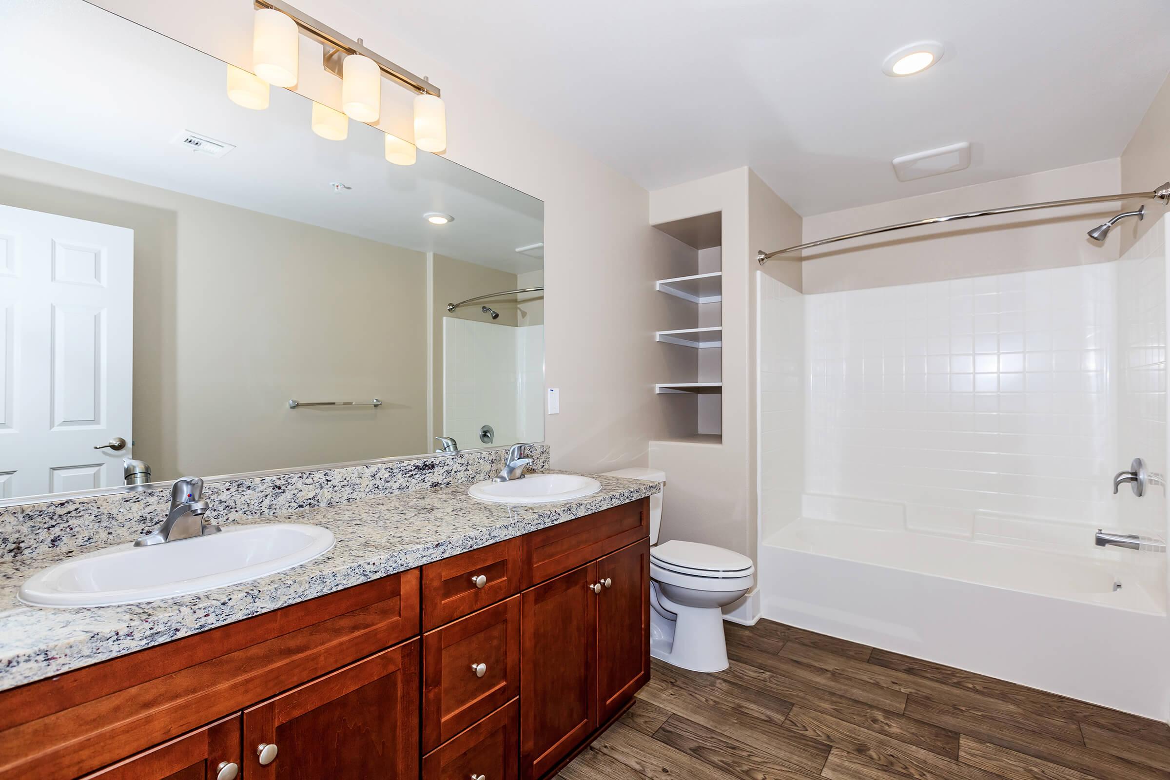 a kitchen with a sink and a mirror