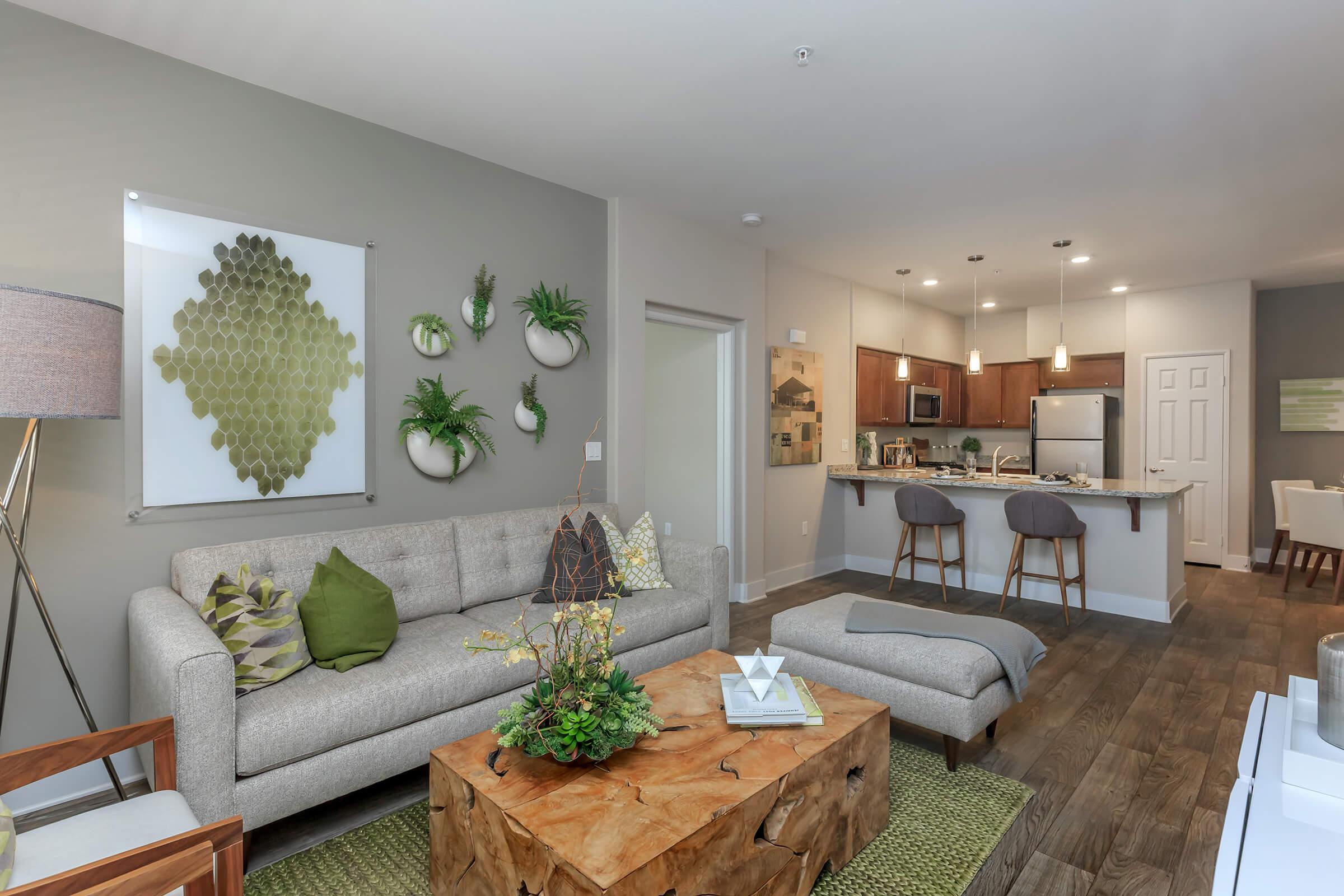 a living room filled with furniture and a flat screen tv